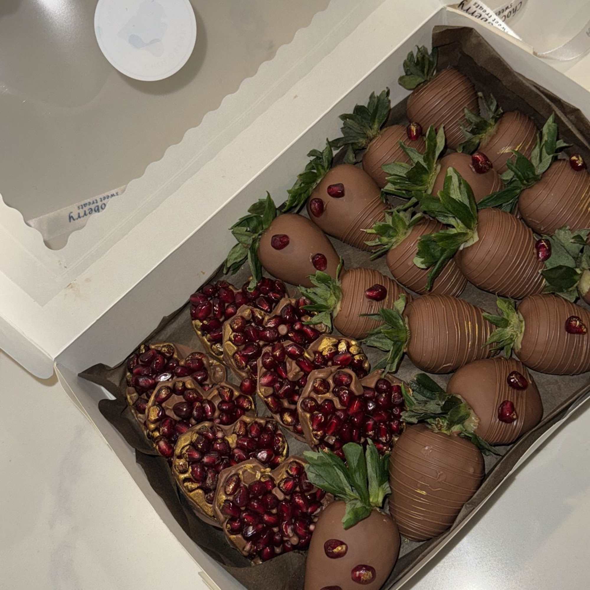 **Chocolate-Dipped Strawberries &amp; Pomegranate Chocolate Gift Box**  

Indulge in a luxurious