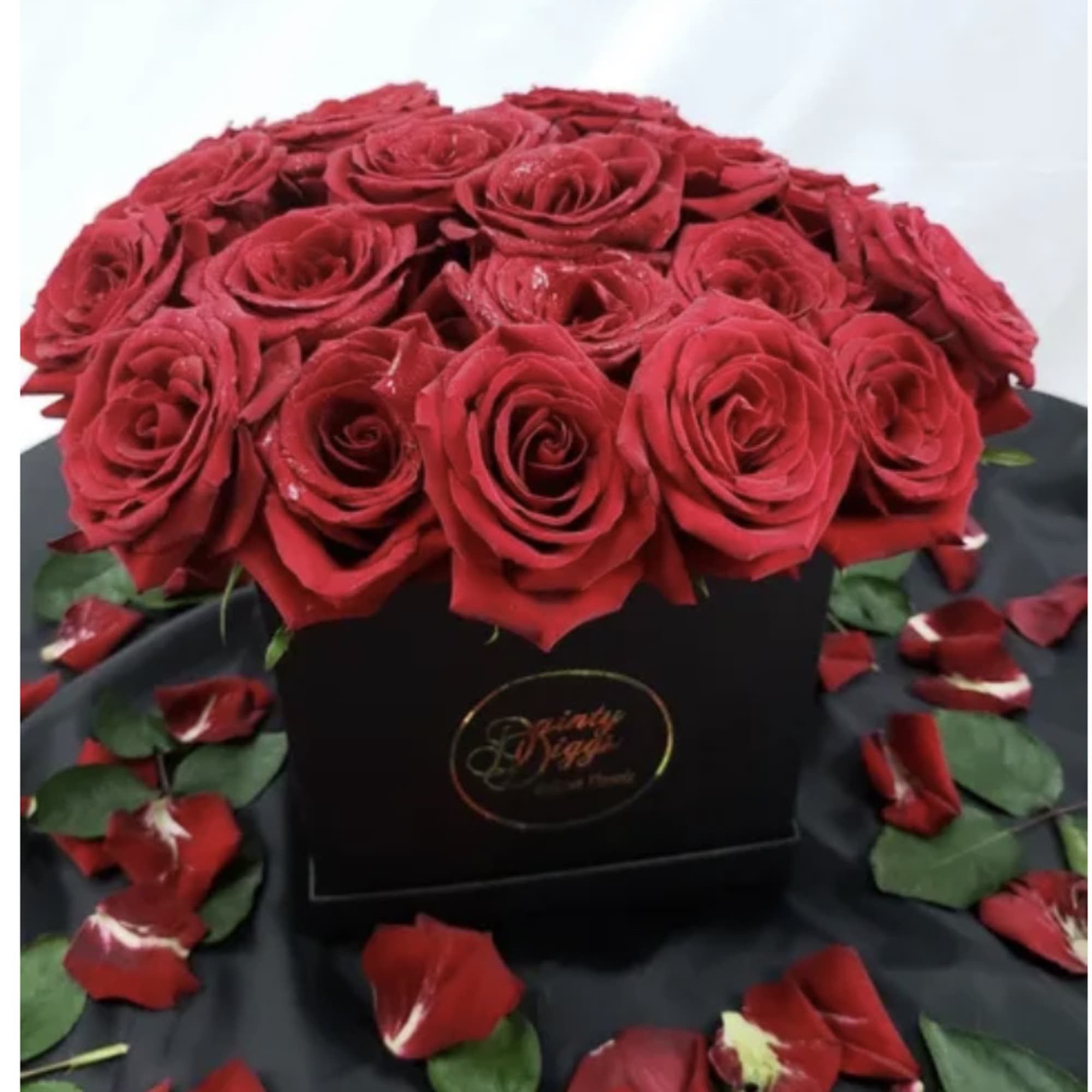 12 (standard) or 24 (deluxe) Premium Roses placed in a decorative waterproof