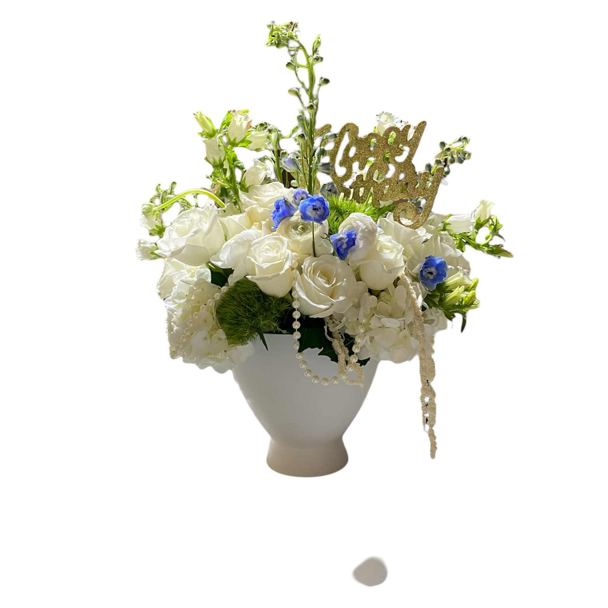 A premium designer&#039;s choice arrangement using season white flowers in short vase.