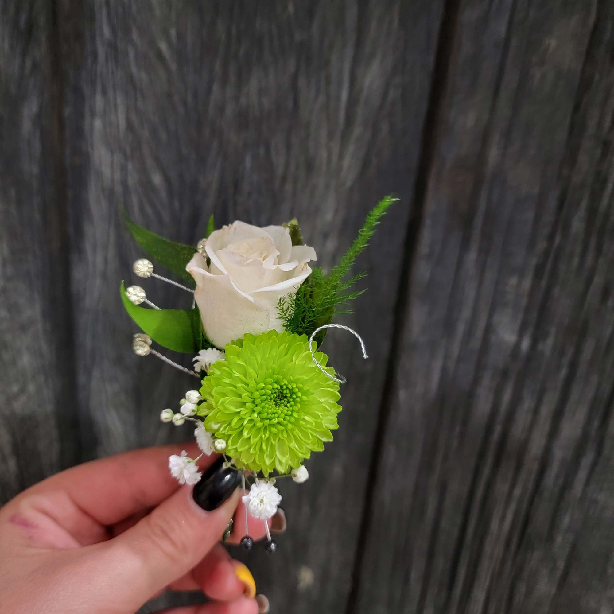 A beautiful Boutinere made in any color choice and flower type. 
Availabe