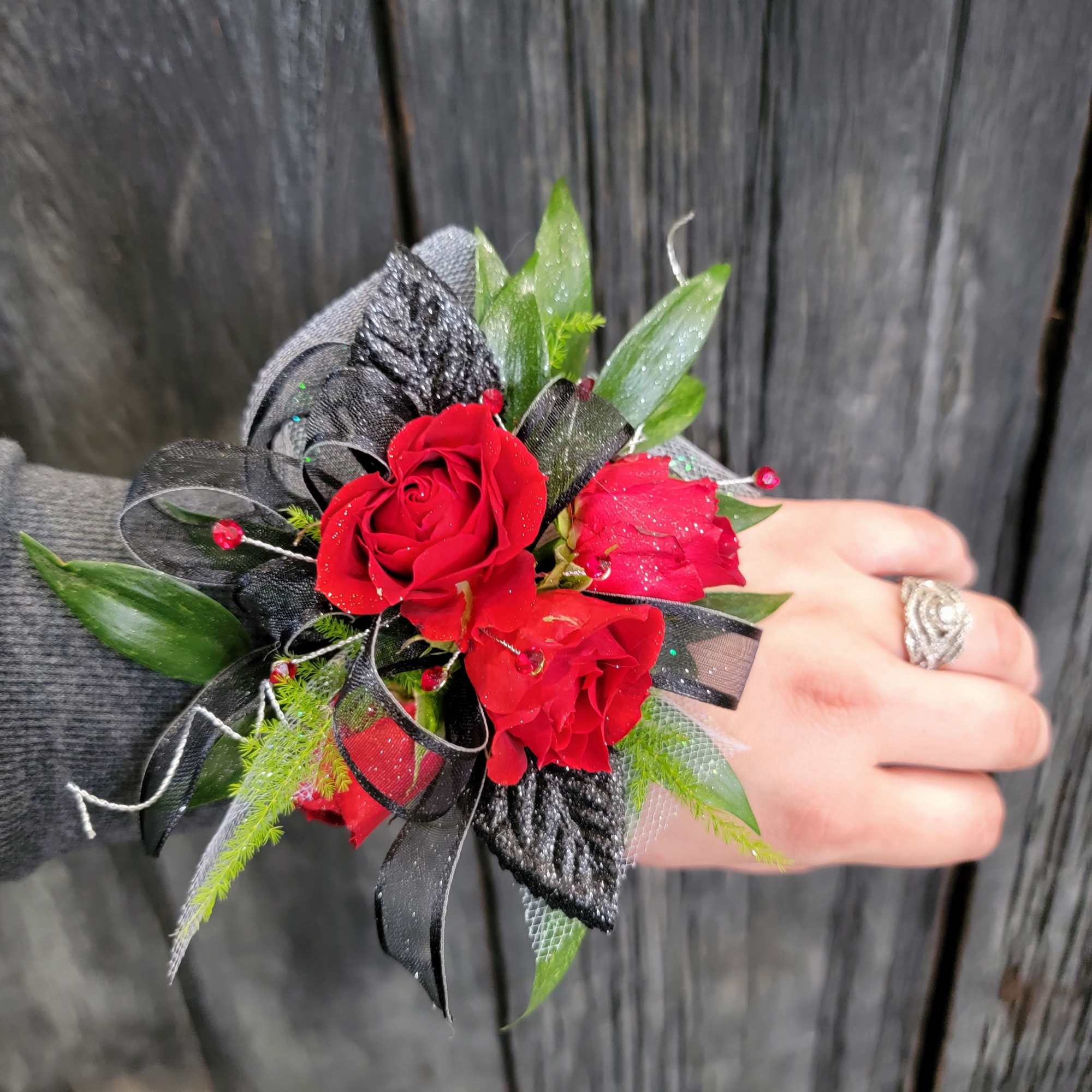 A beautiful red corsage made with your choice of flowers. 
Options include: