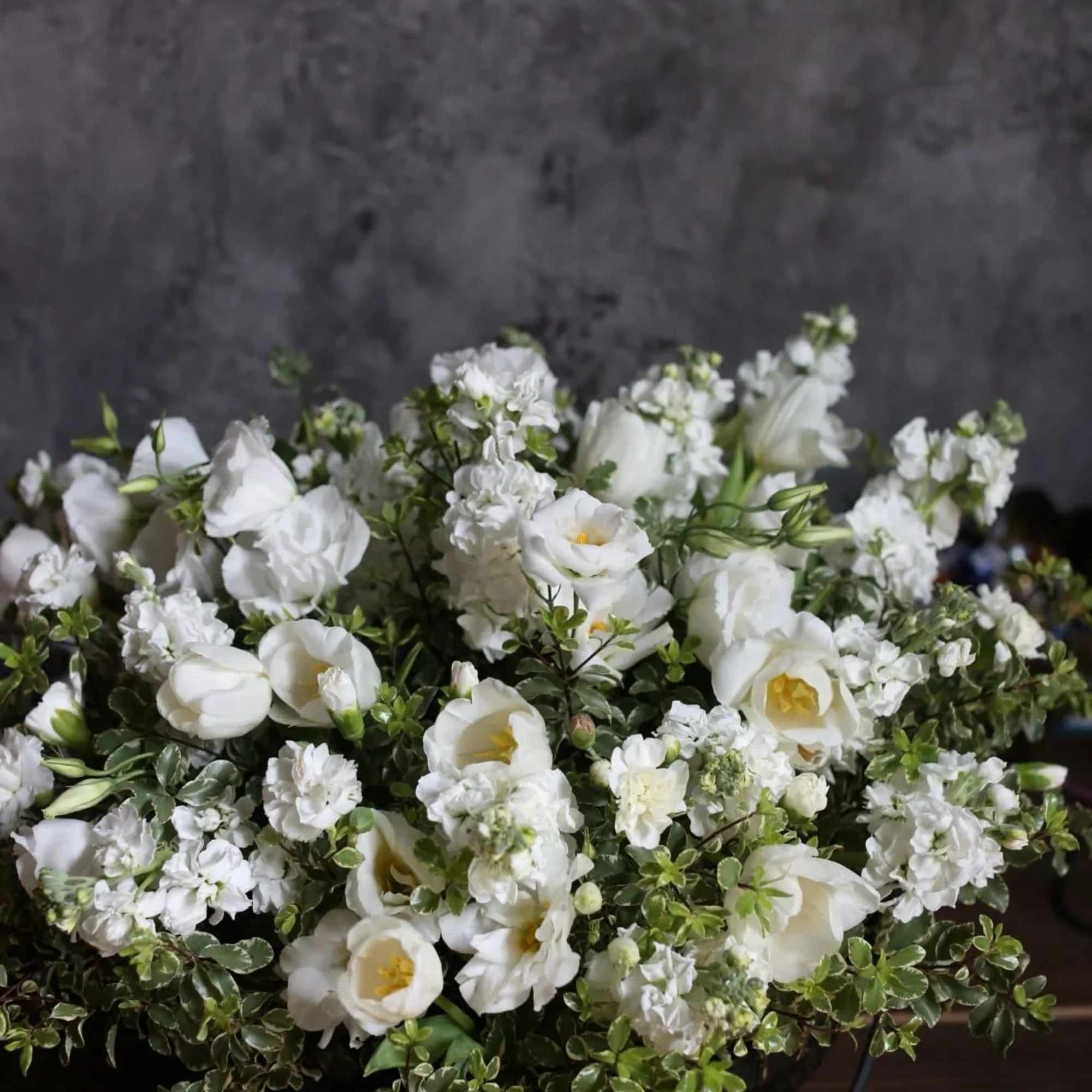 Princess is a basket with all white flowers. Mix of roses, hydrangea