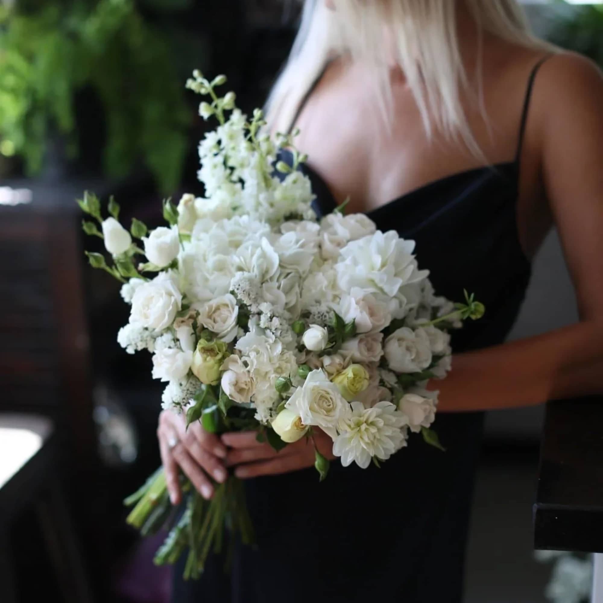 Adele is a beautiful bridal bouquet featuring a mix of fresh white