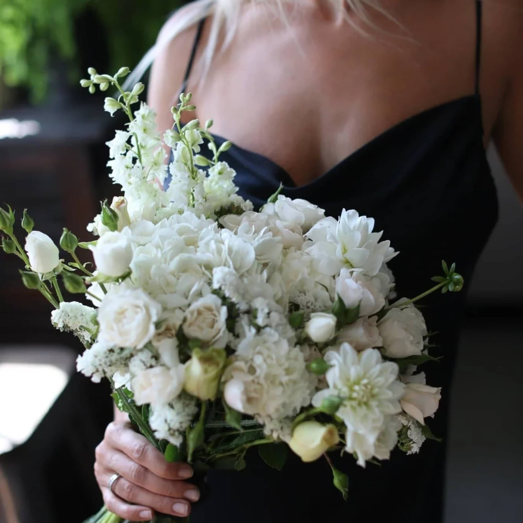 Adele is a beautiful bridal bouquet featuring a mix of fresh white