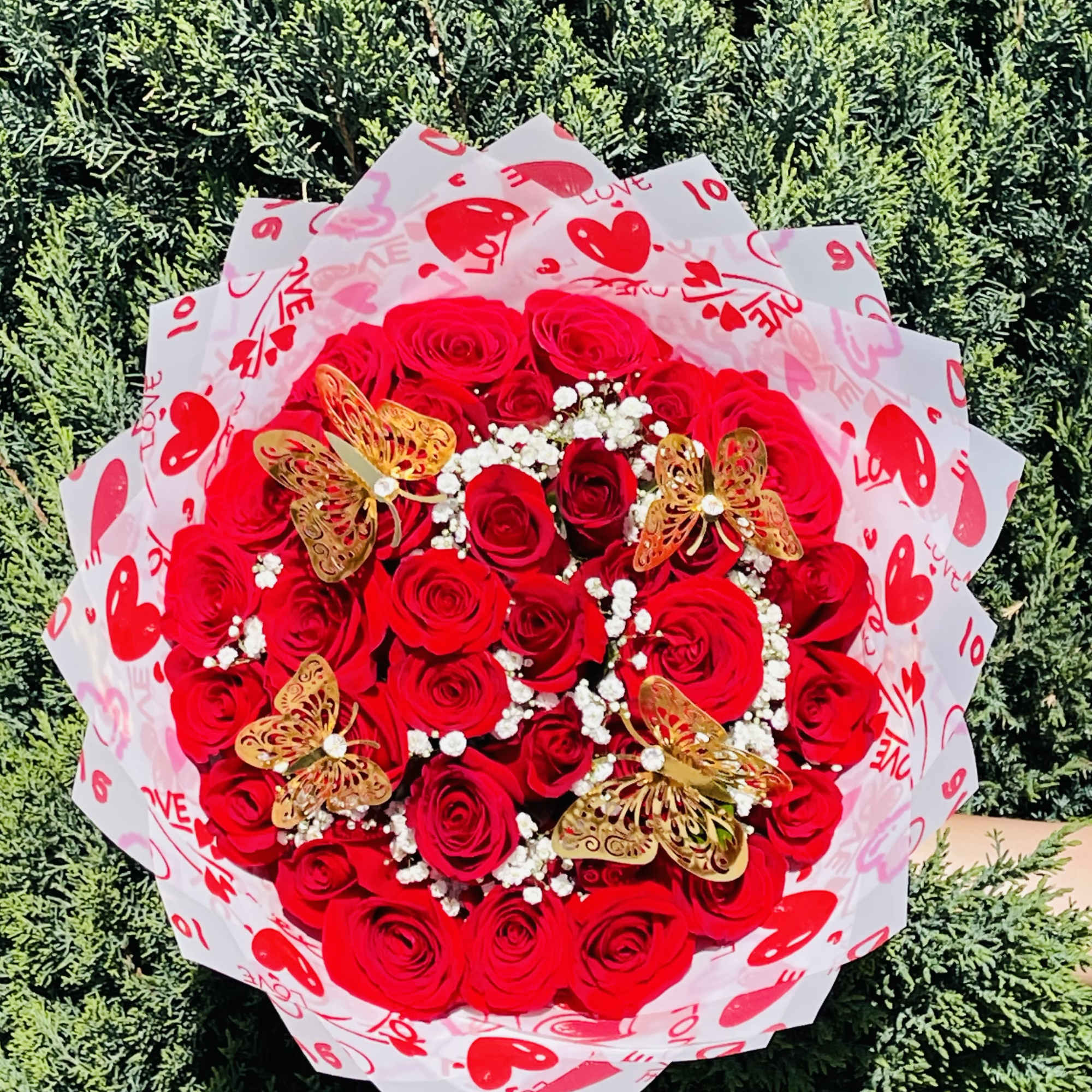 36 red roses wrapped in Korean paper with heart designs