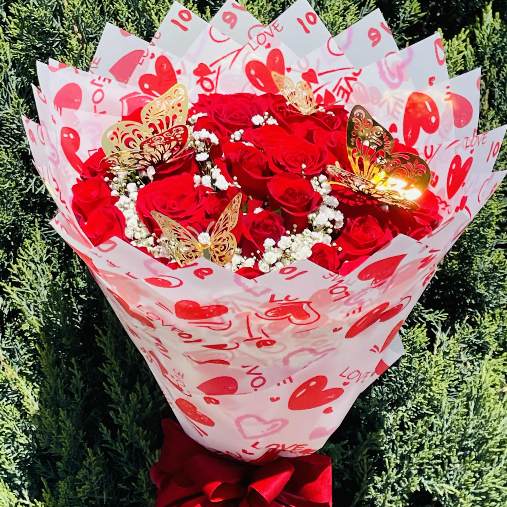 36 red roses wrapped in Korean paper with heart designs