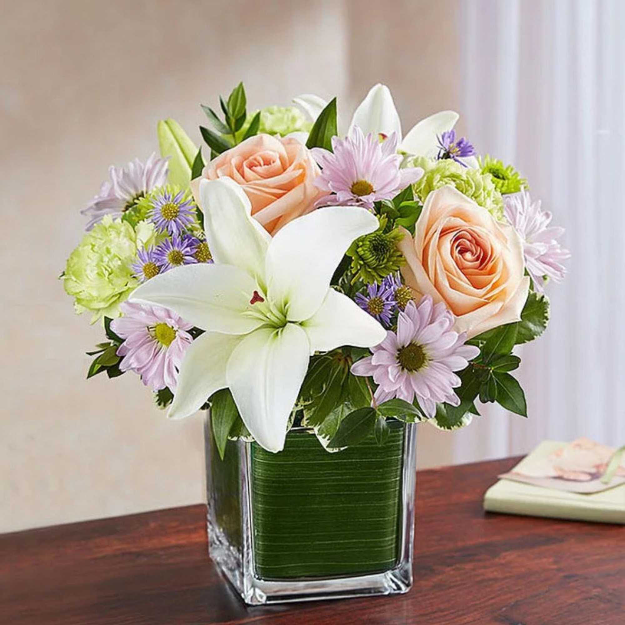 Soothe an aching heart with a sentimental tribute in soft, delicate shades.