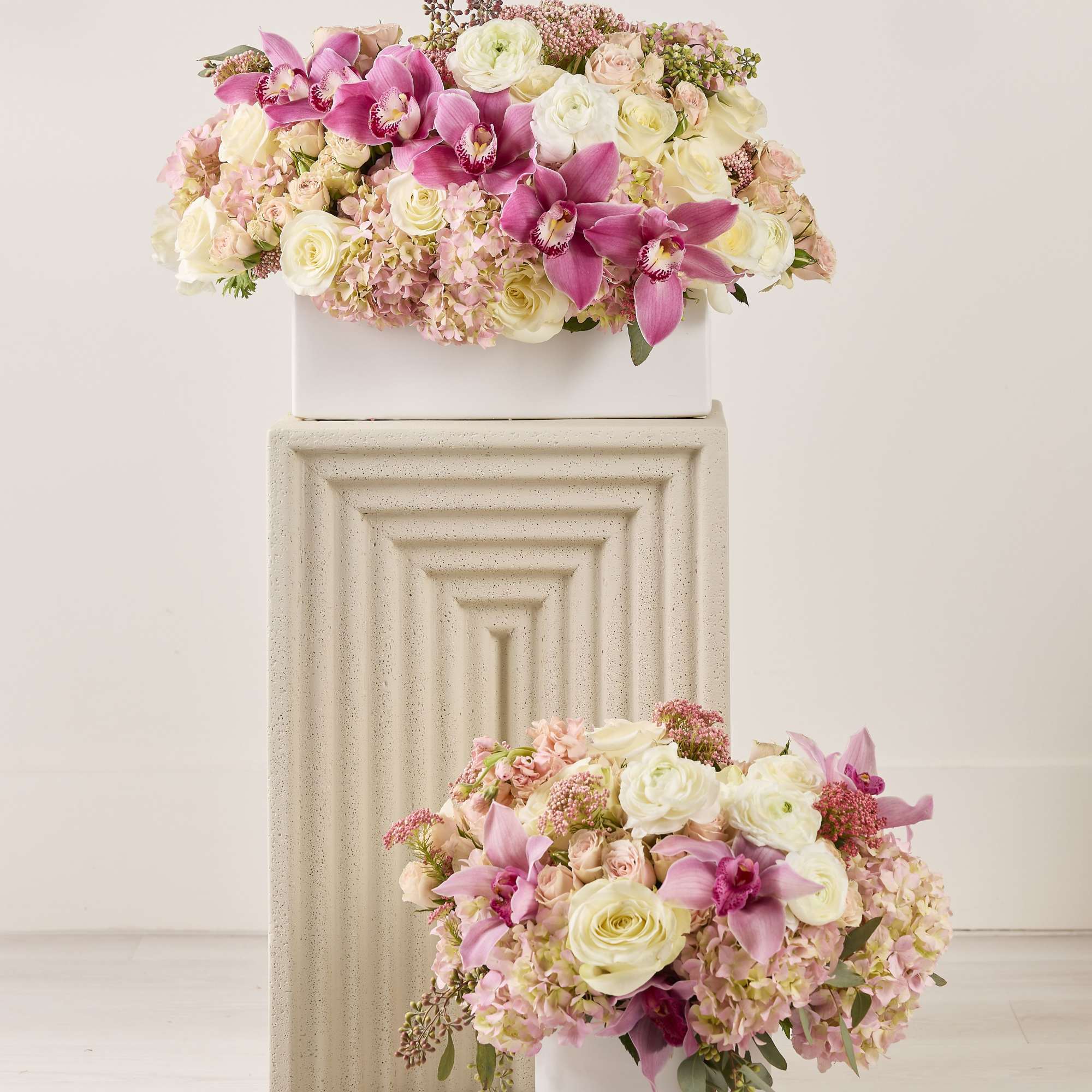 A white and pink floral arrangement can be described as a harmonious