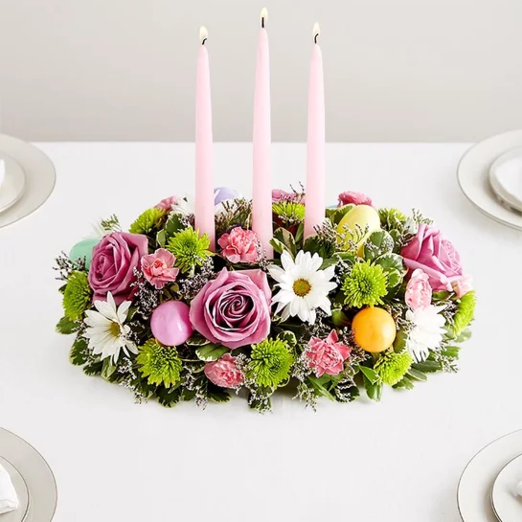 Celebrate Easter with this beautiful centerpiece of roses, daisies, mums, and fresh