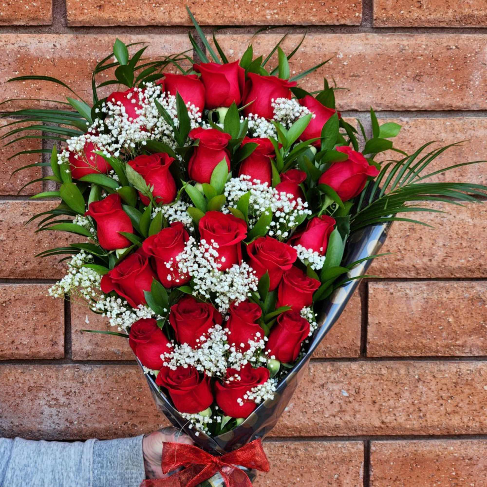 Show your love with our hand-tied bouquet of Ecuadorian long stem roses.