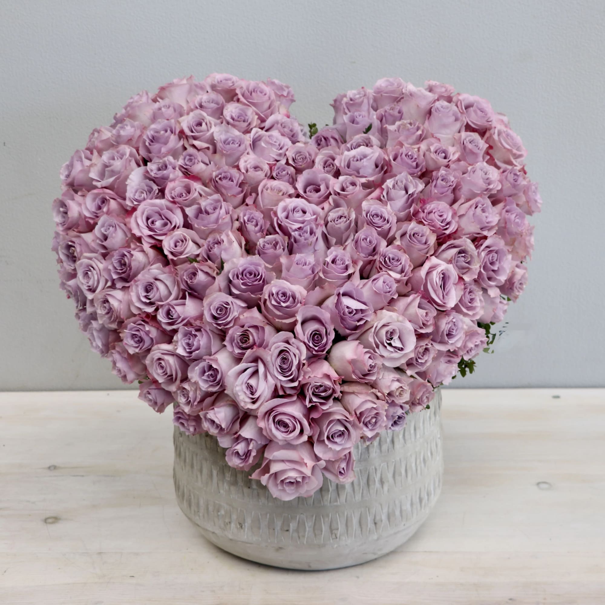 This hand crafted heart arrangement consists of 100 premium red roses. 
Make