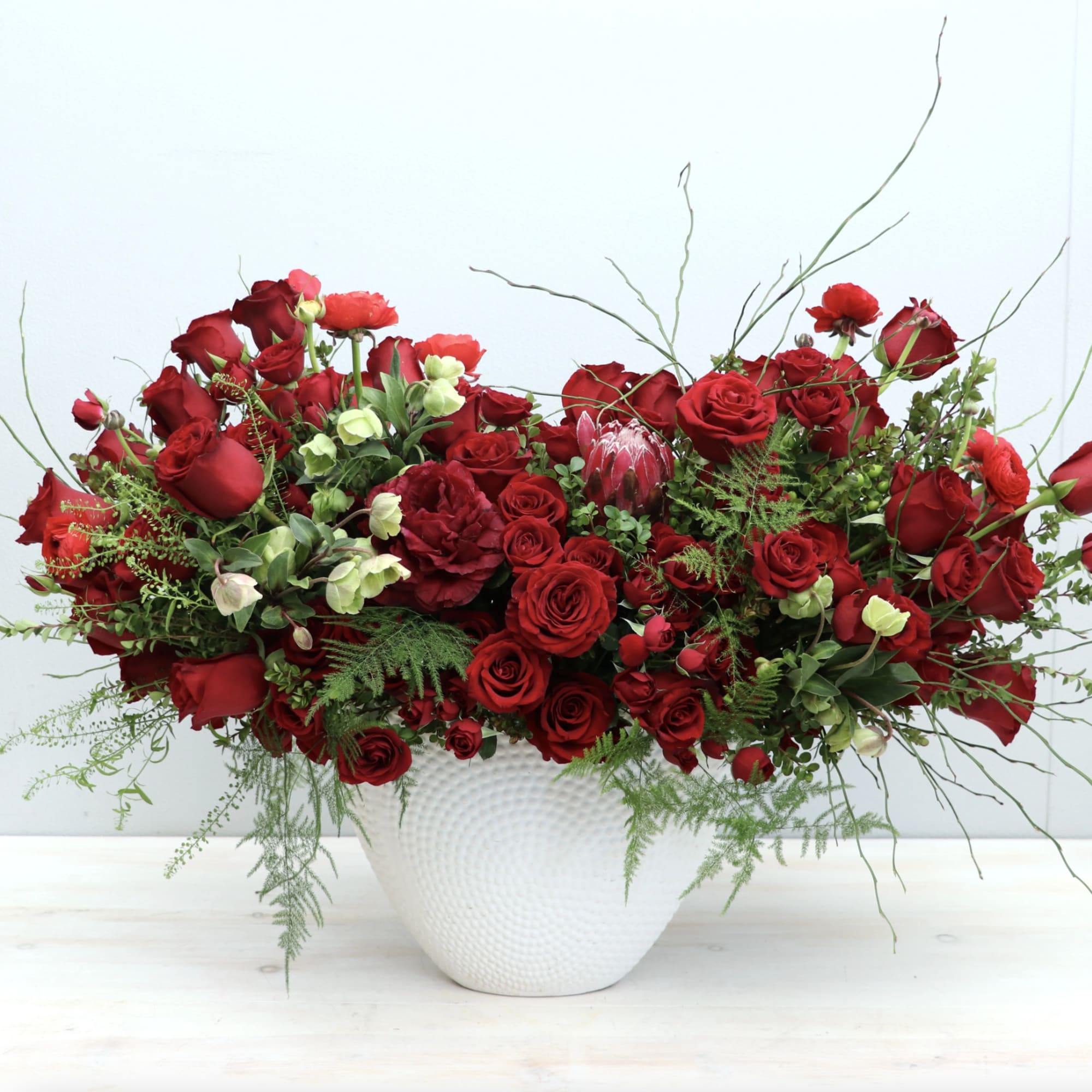 This classic red rose arrangement is the sweetest reminder of your love