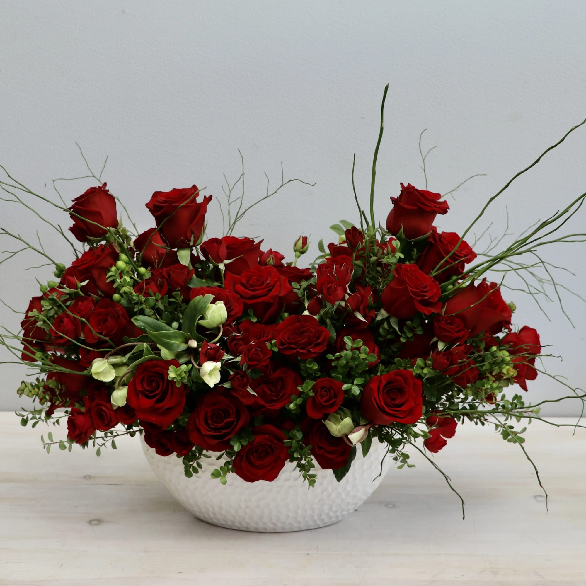 This classic red rose arrangement is the sweetest reminder of your love