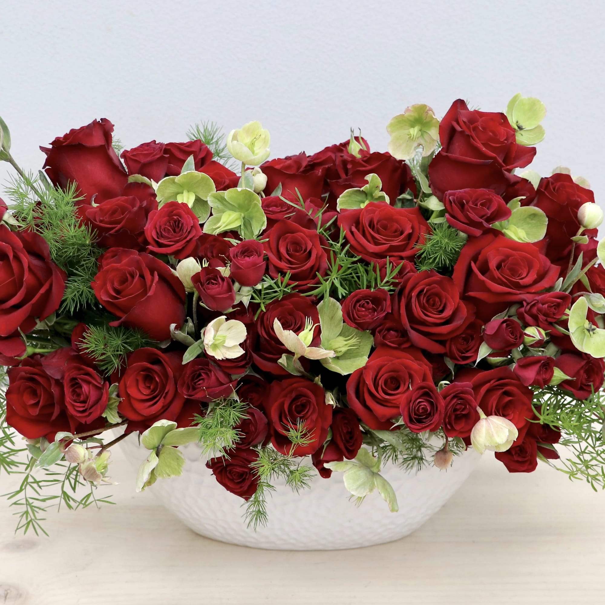This classic red rose arrangement is the sweetest reminder of your love