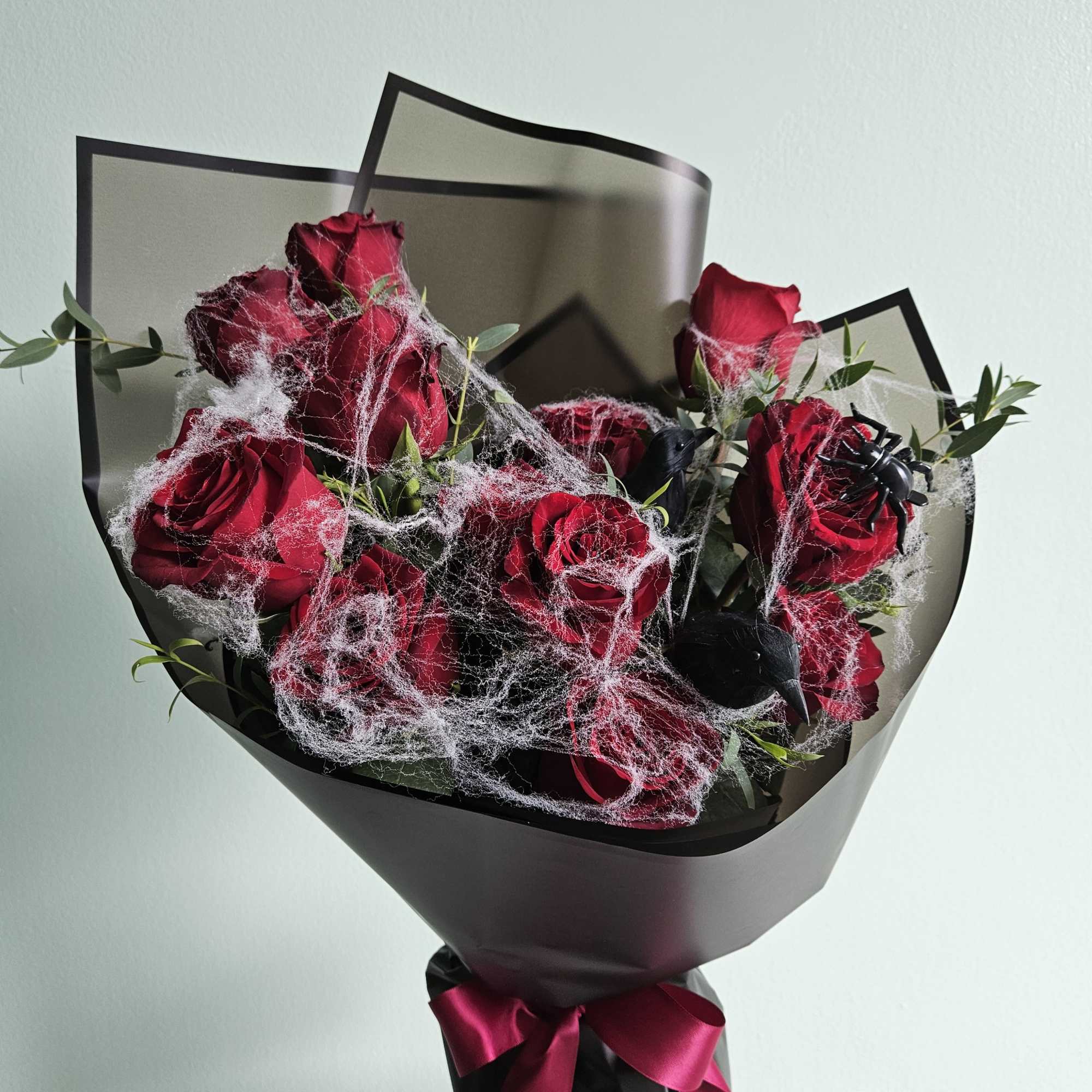 Our Ravens' Rose Ritual bouquet is a hauntingly beautiful arrangement, perfect for
