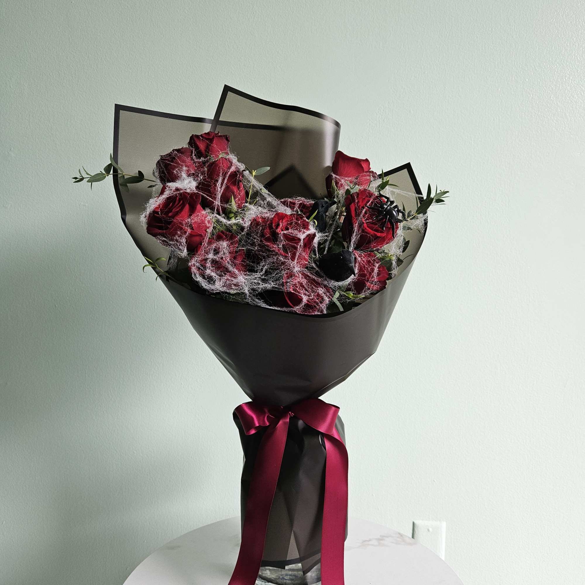 Our Ravens' Rose Ritual bouquet is a hauntingly beautiful arrangement, perfect for