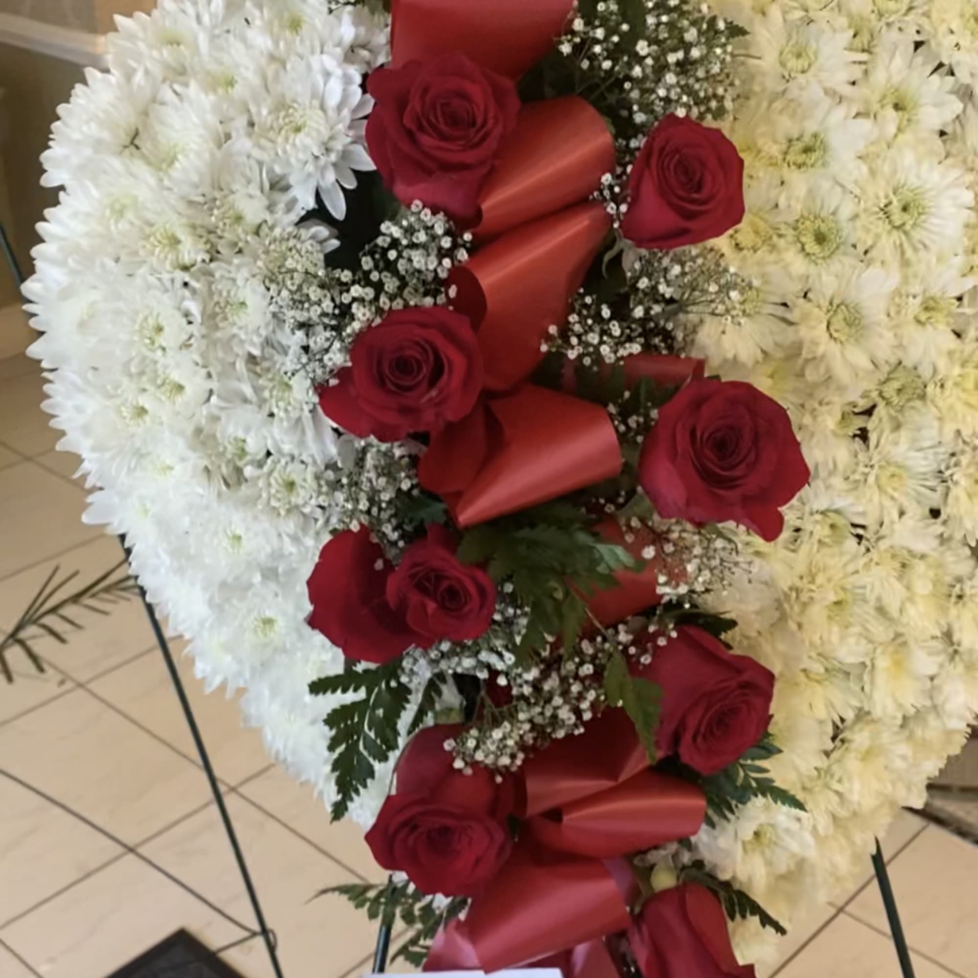 Heart shape floral design with design splitting heart  Heart shape floral design with design splitting heart