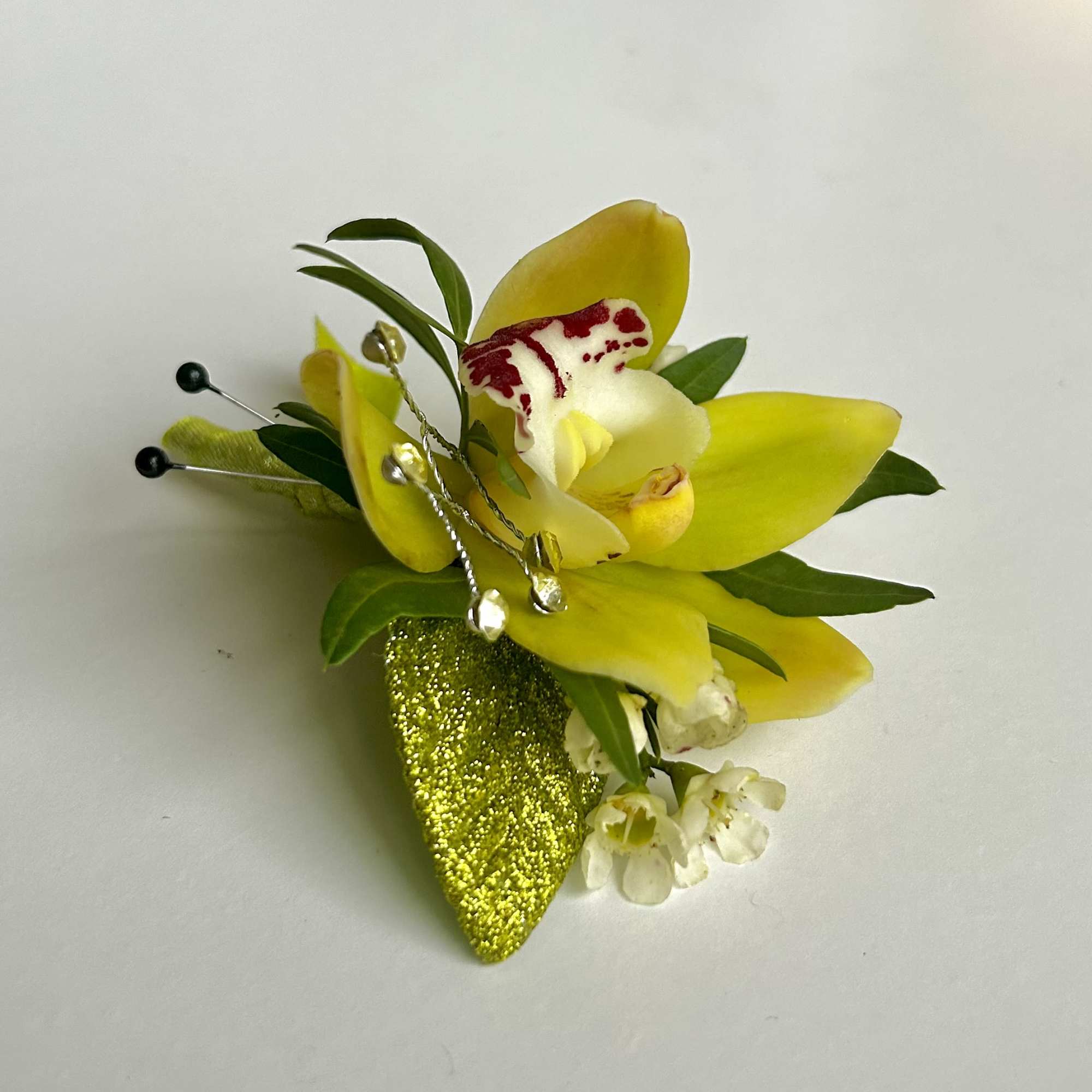 A beautiful Mini Cymbidium Orchid Corsage for Prom or Homecoming boys.