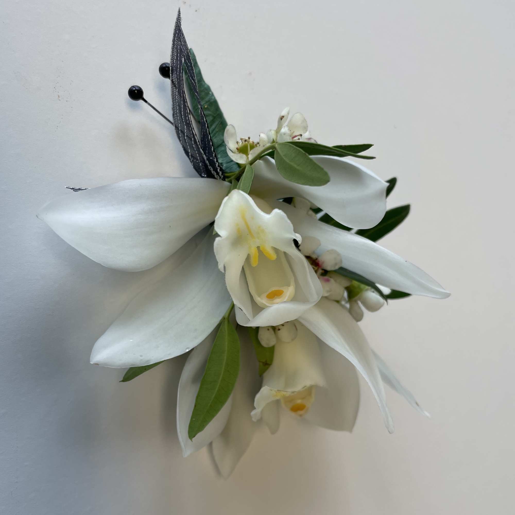 A beautiful Mini Cymbidium Orchid Corsage for Prom or Homecoming boys.