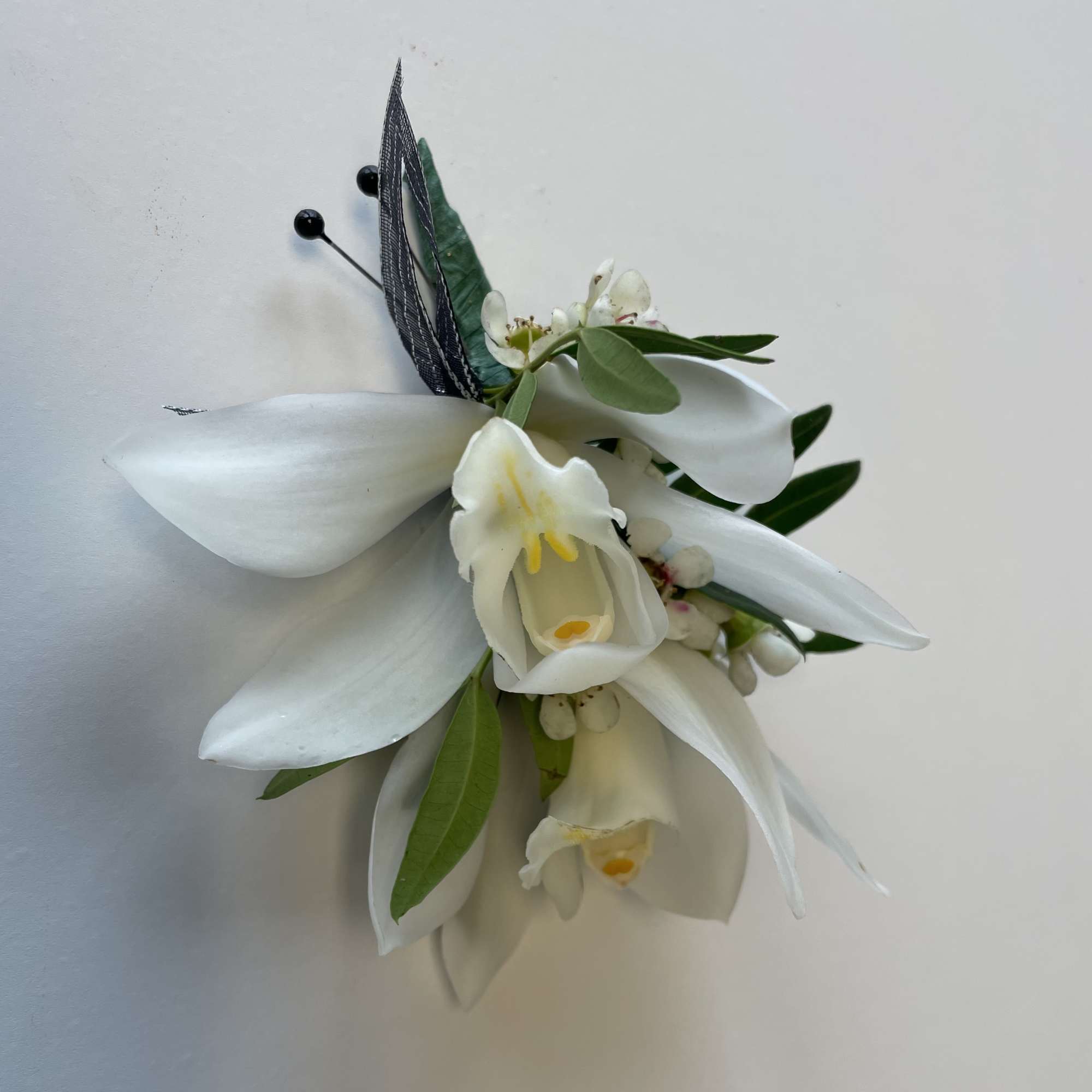 A beautiful Mini Cymbidium Orchid Corsage for Prom or Homecoming boys.