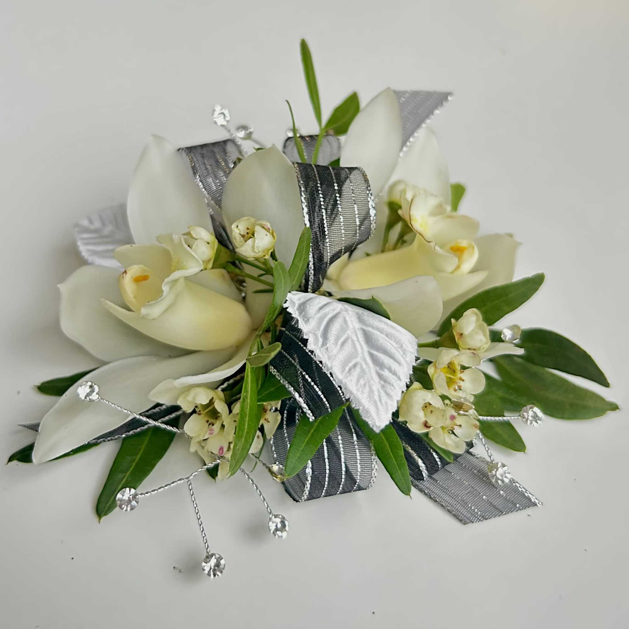 A beautiful Mini Cymbidium Orchid Corsage for Prom or Homecoming girls. 