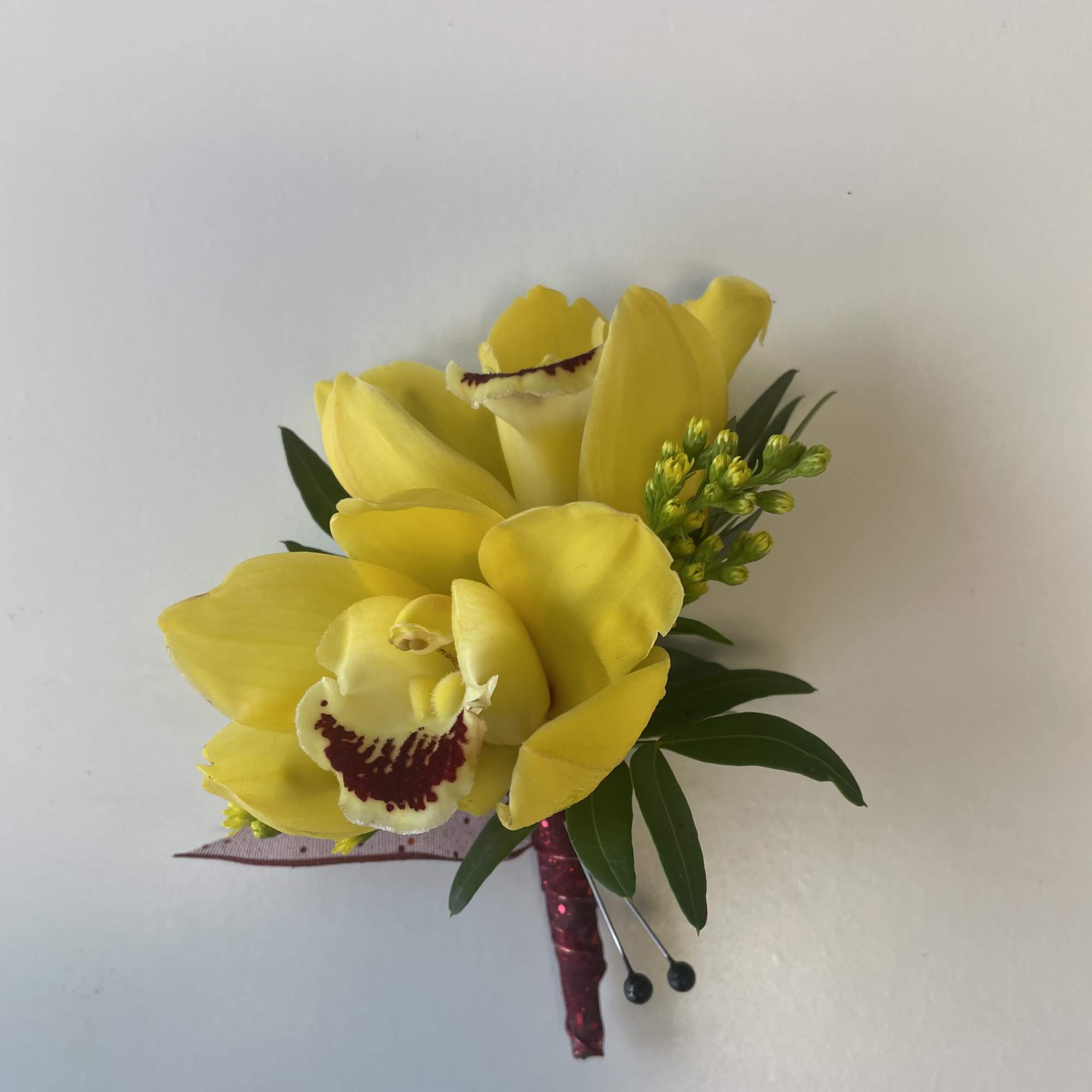 A beautiful Mini Cymbidium Orchid Corsage for Prom or Homecoming boys.