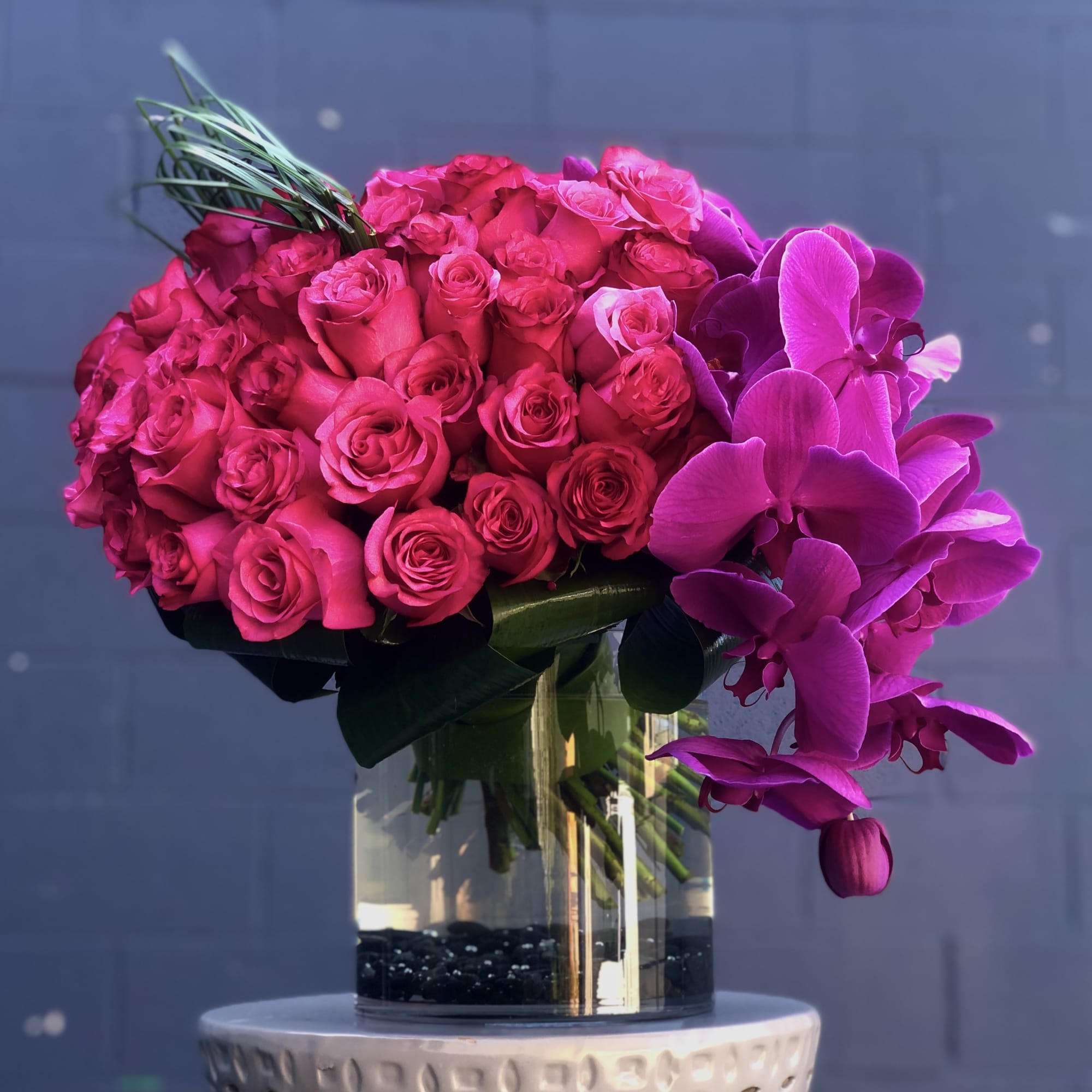colorful hot pink roses and orchids 