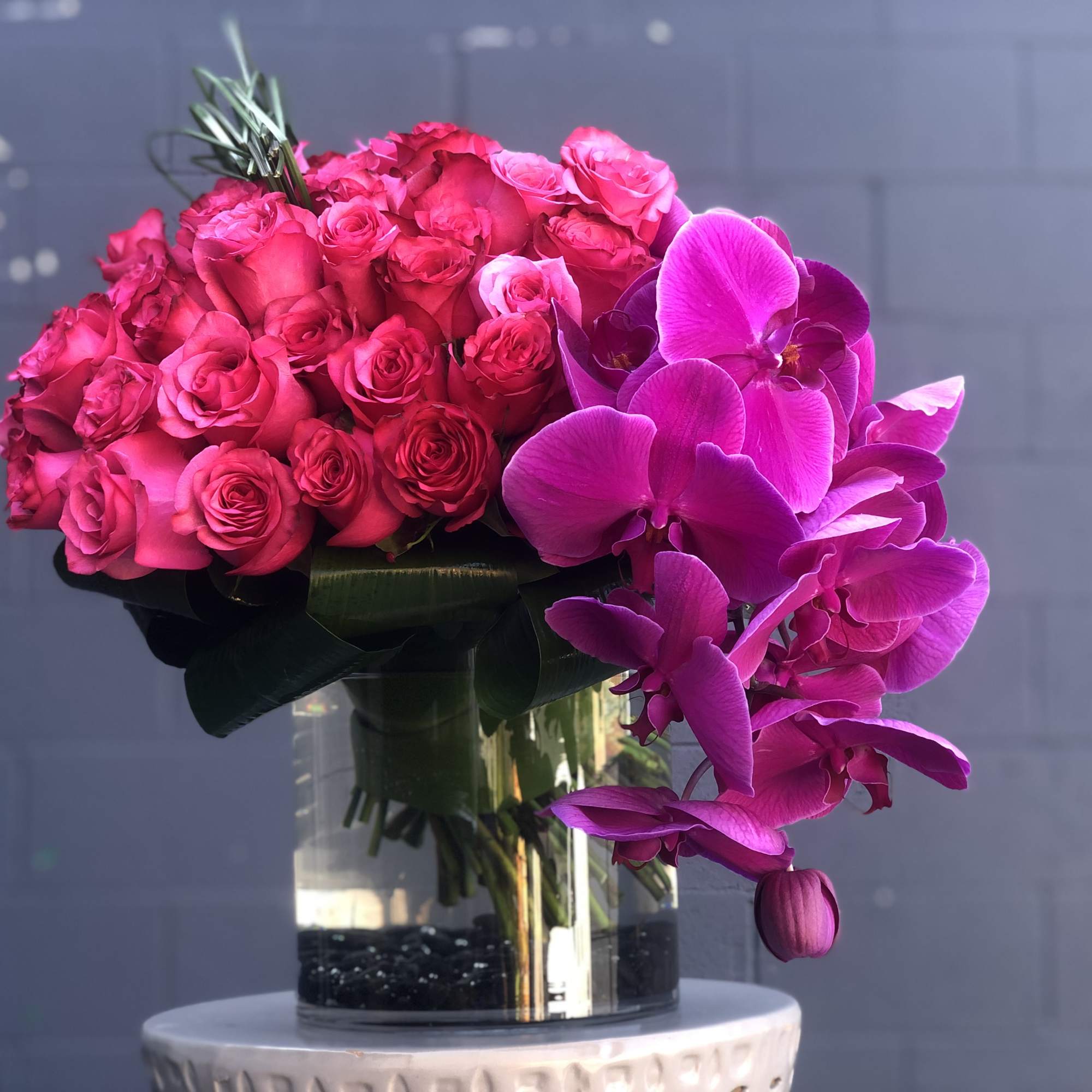 colorful hot pink roses and orchids 