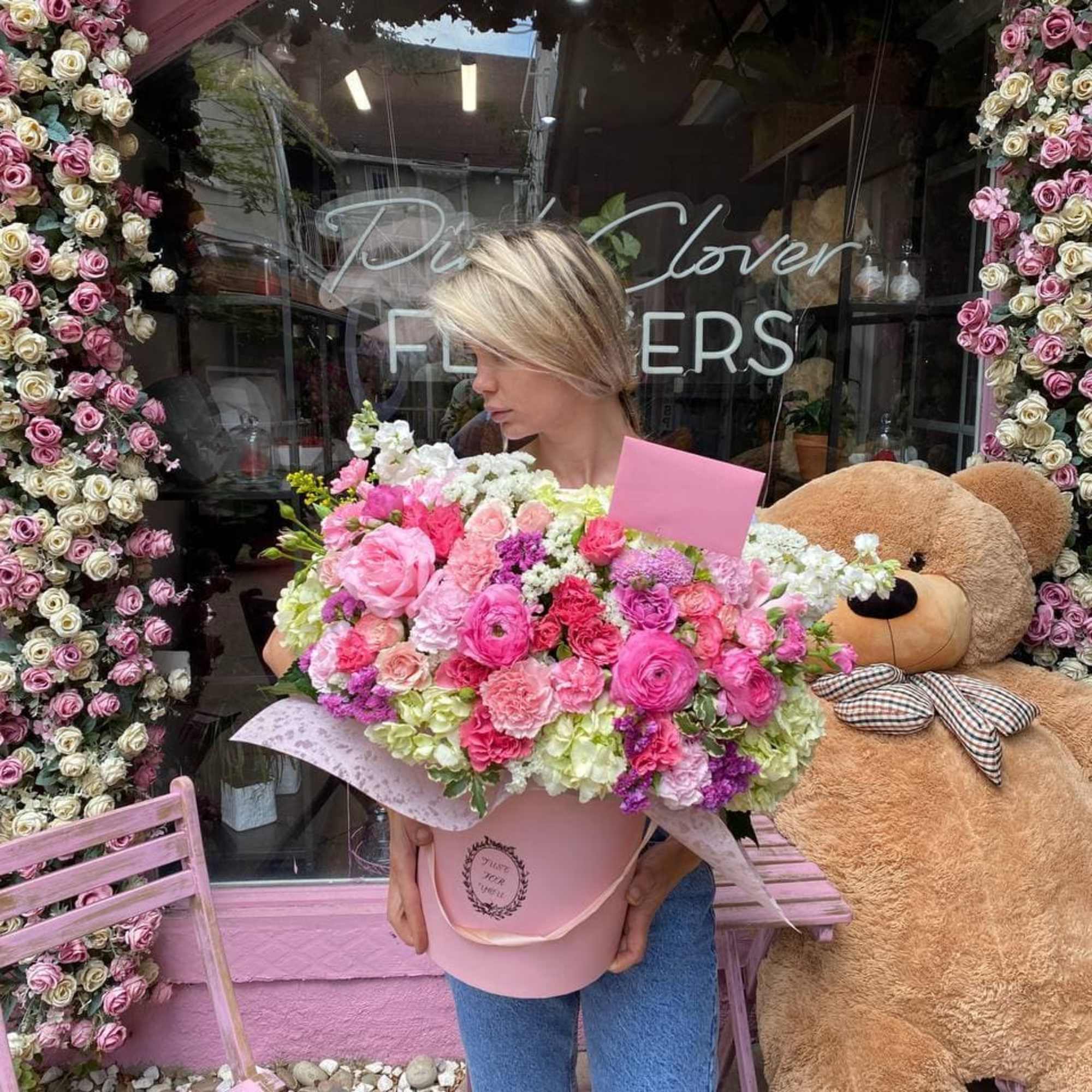 Arrangement of white hydrangea, ranunculus,carnations and roses.