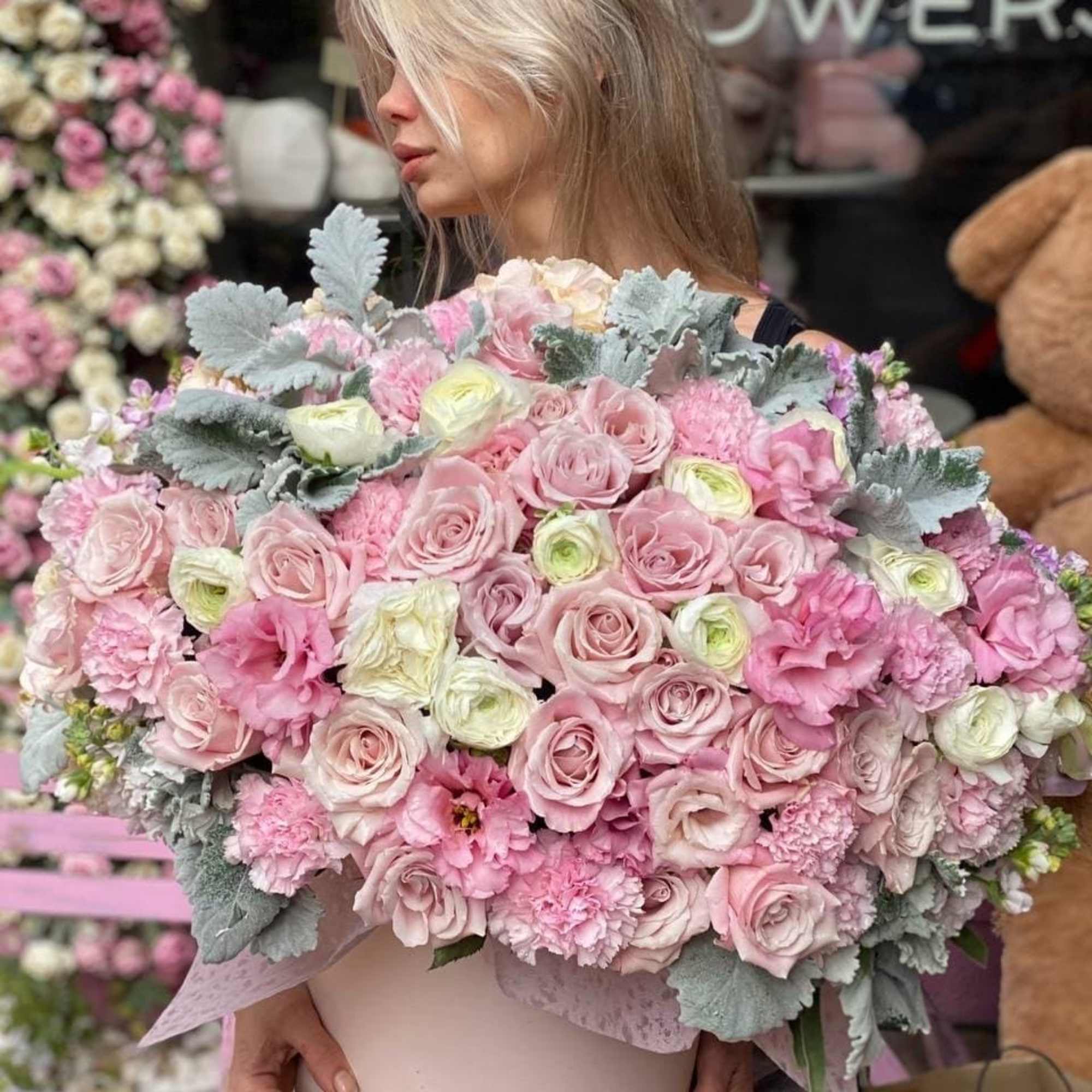 Pink heaven floral arrangement consists of two types of roses, hydrangea, ranunculus