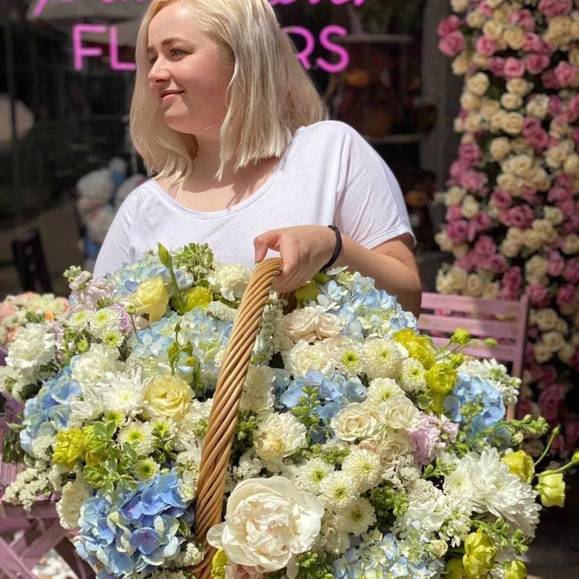 Diana is a beautiful floral arrangement with hydrangeas, lisianthus, blooms, greenery, roses