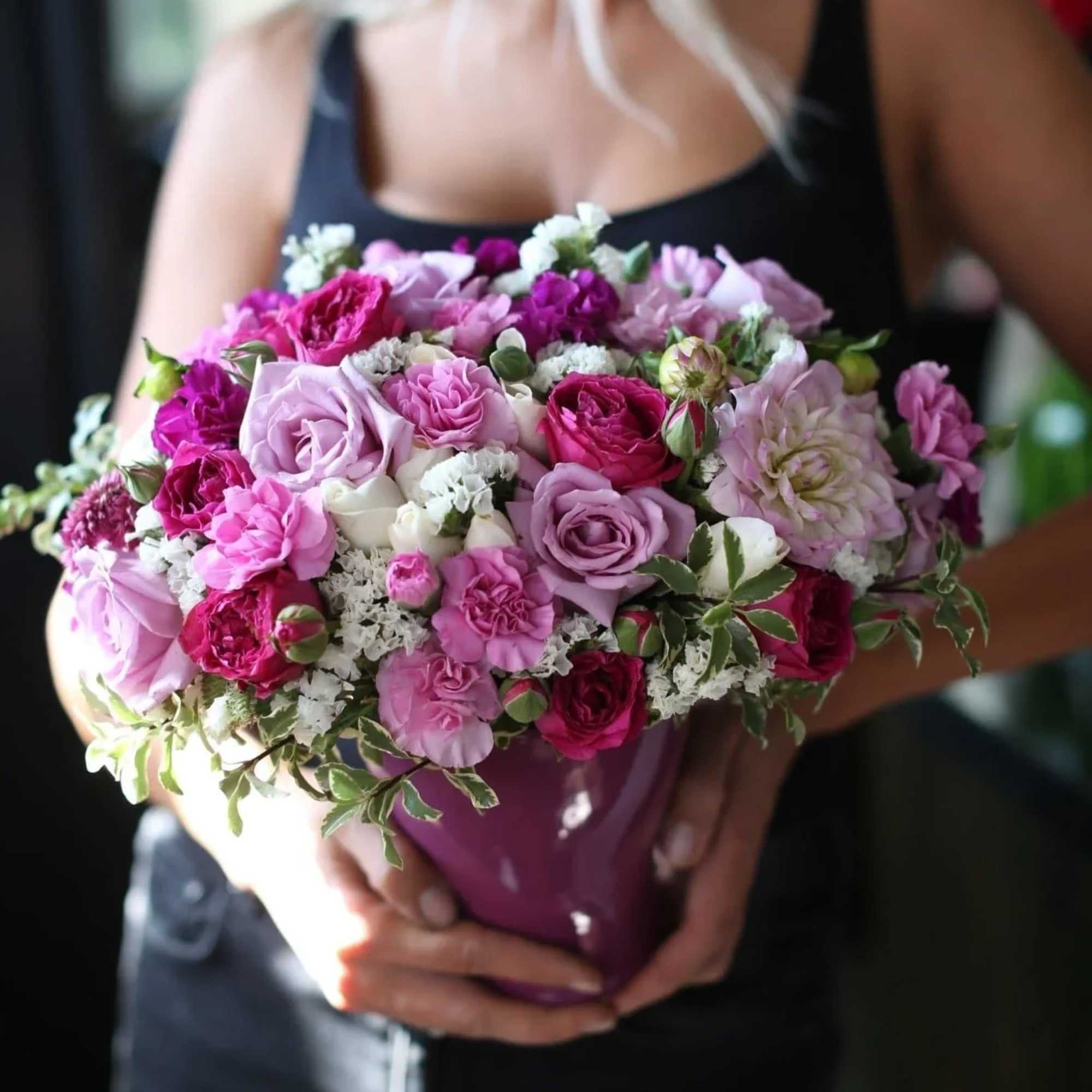 Anastasia is a pink flower arrangement with pink and white roses, purple