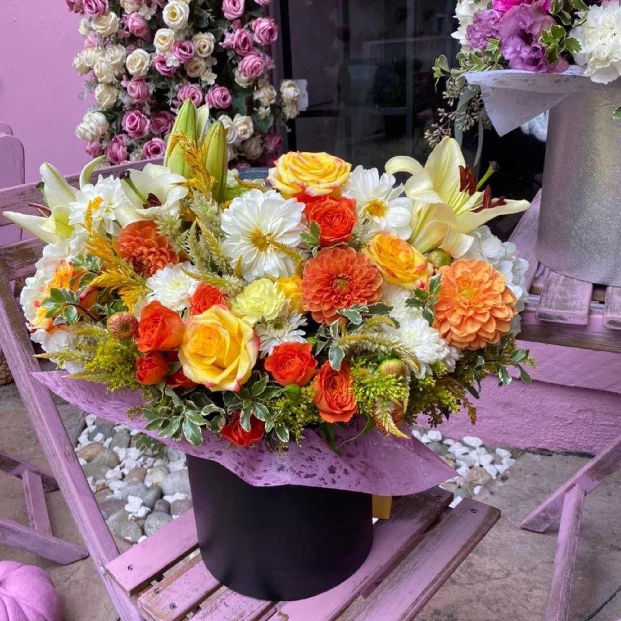 Amelita is a cute and colorful flower box with bright dahlias, orange