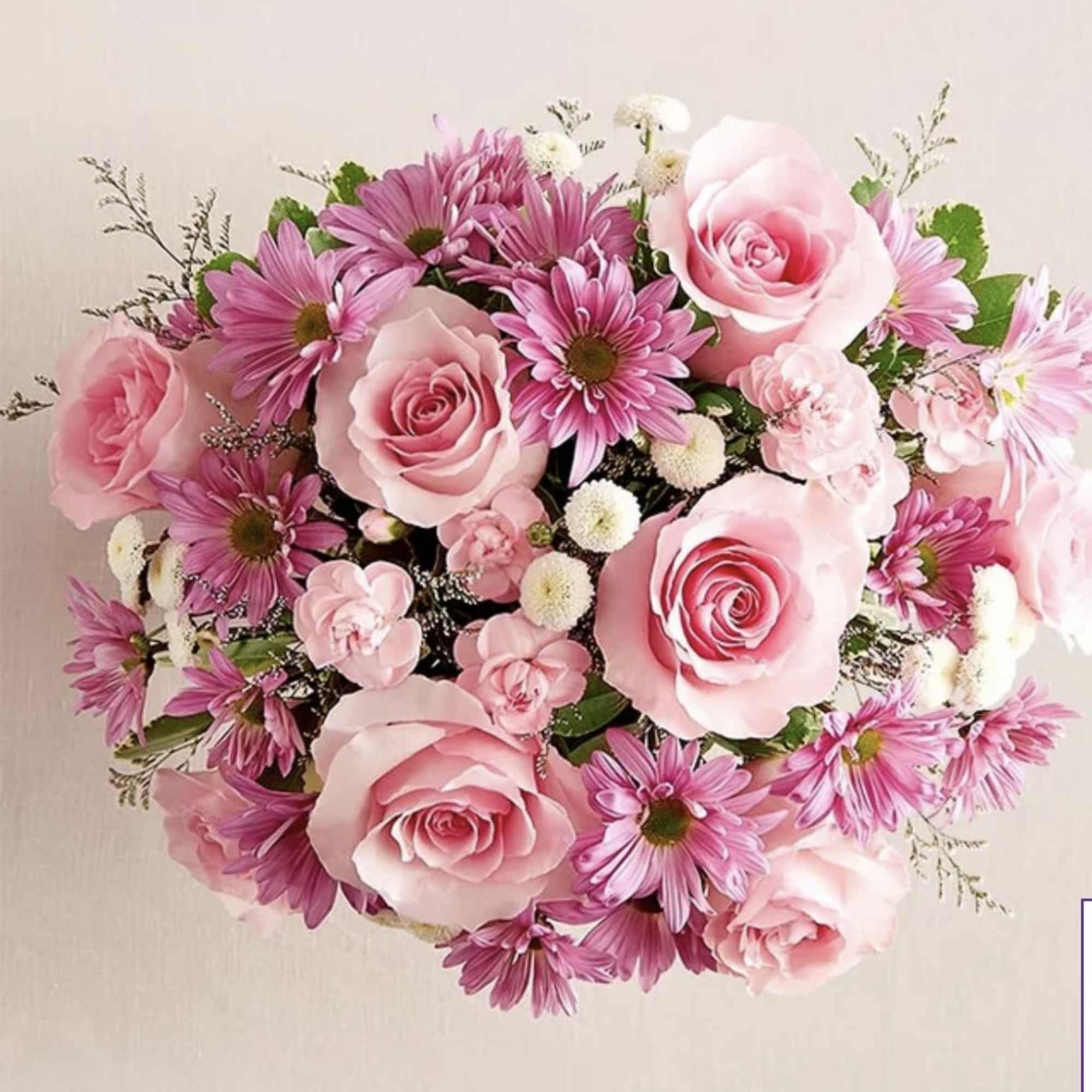 The ultimate arrangement for your favorite fashion. A profusion of roses, poms
