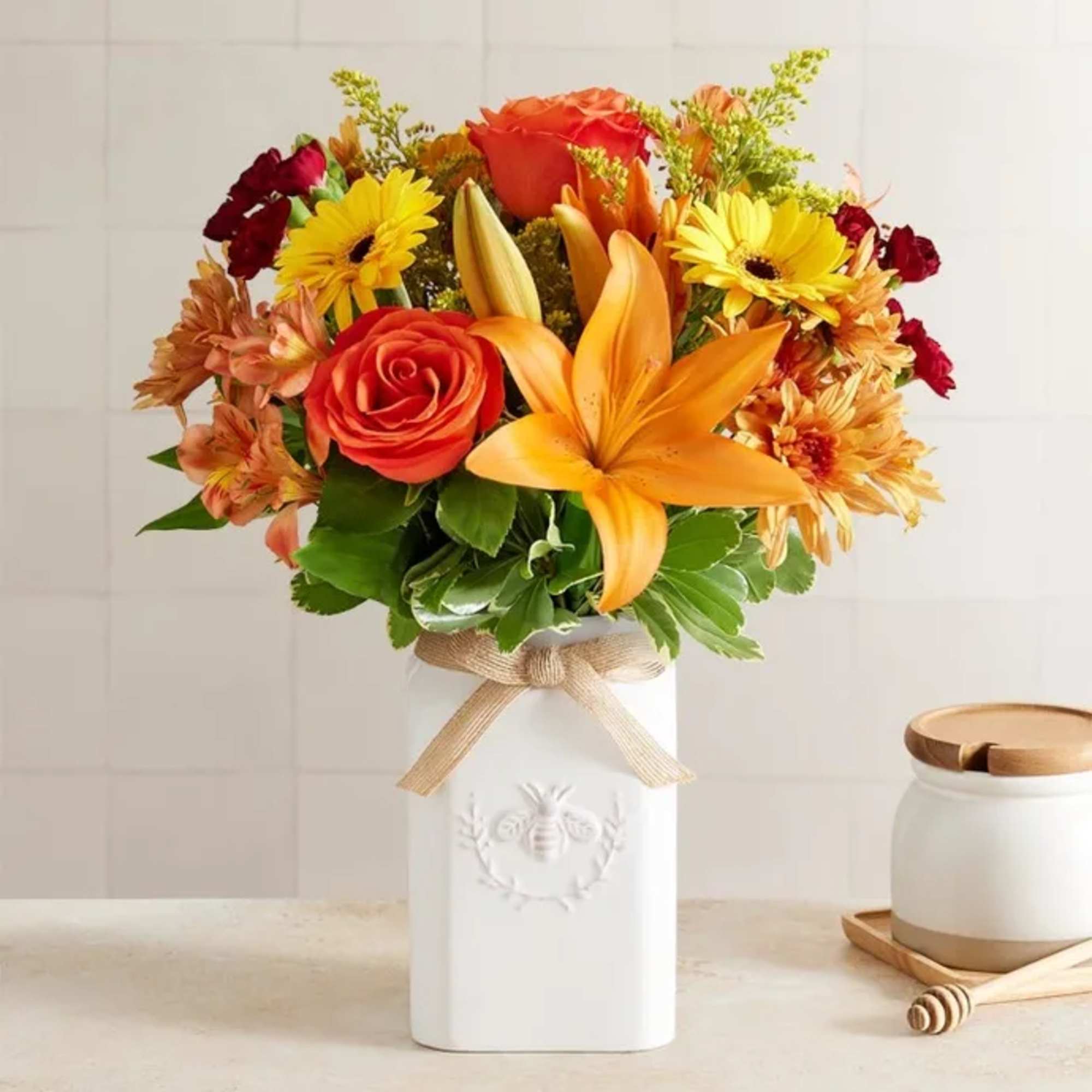 Get them buzzing for fall! Our unique, stylized bouquet is gathered with