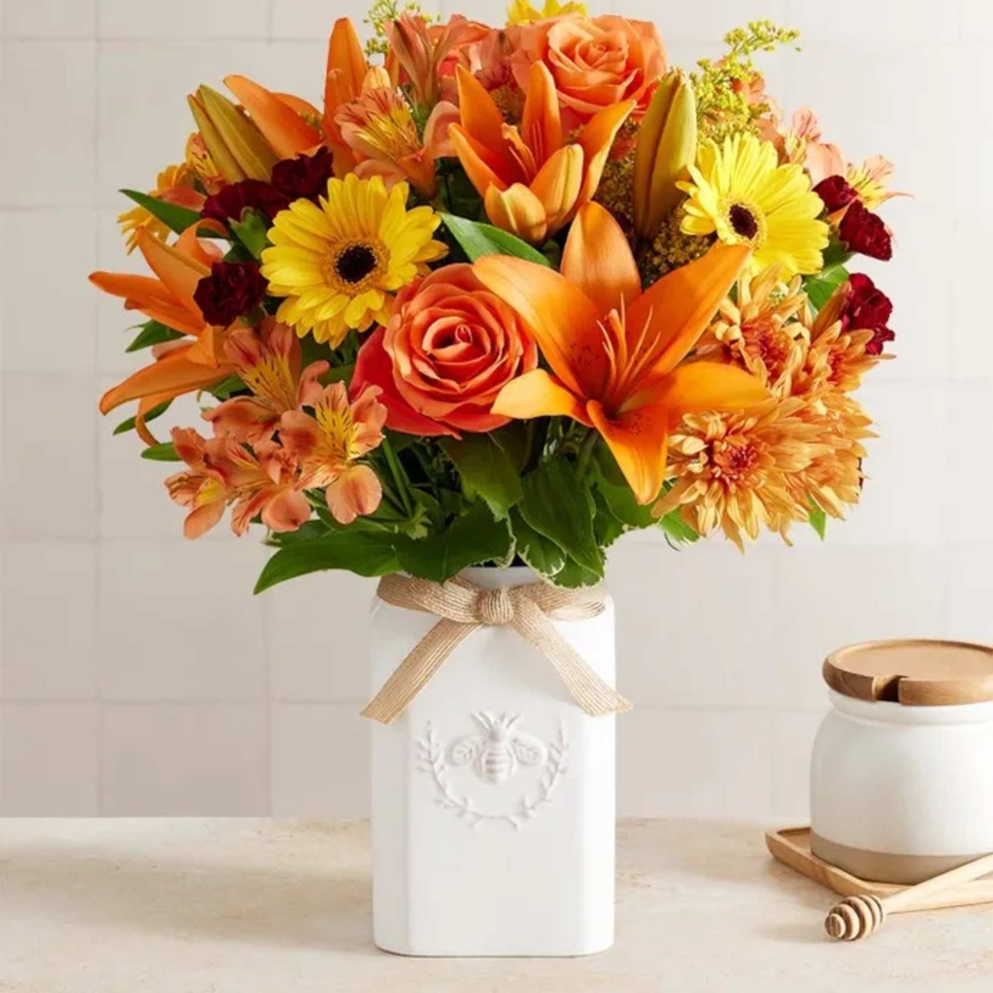 Get them buzzing for fall! Our unique, stylized bouquet is gathered with