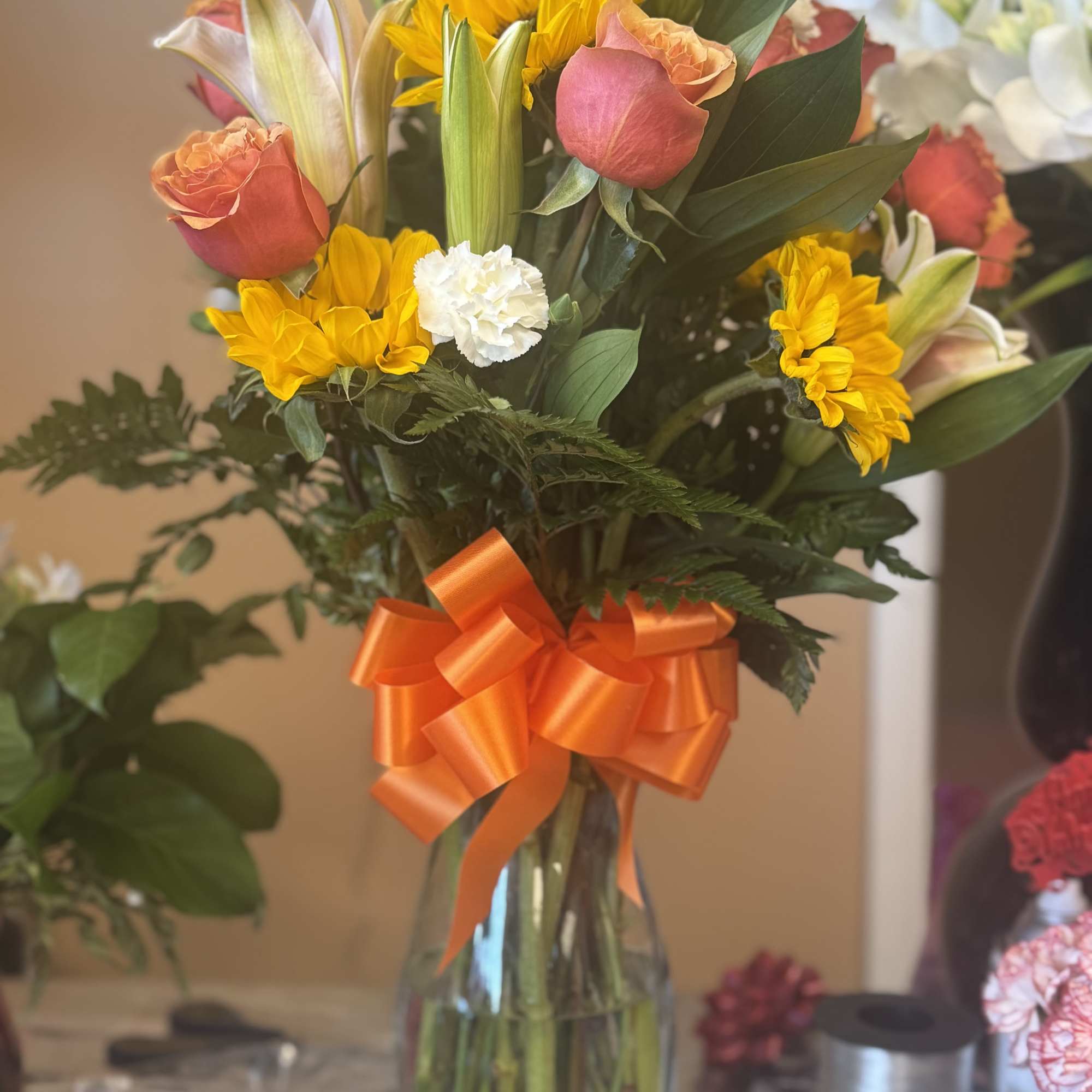 A boho arrangement featuring an eclectic mix of flowers and textures, this A boho arrangement featuring an eclectic mix of flowers and textures, this