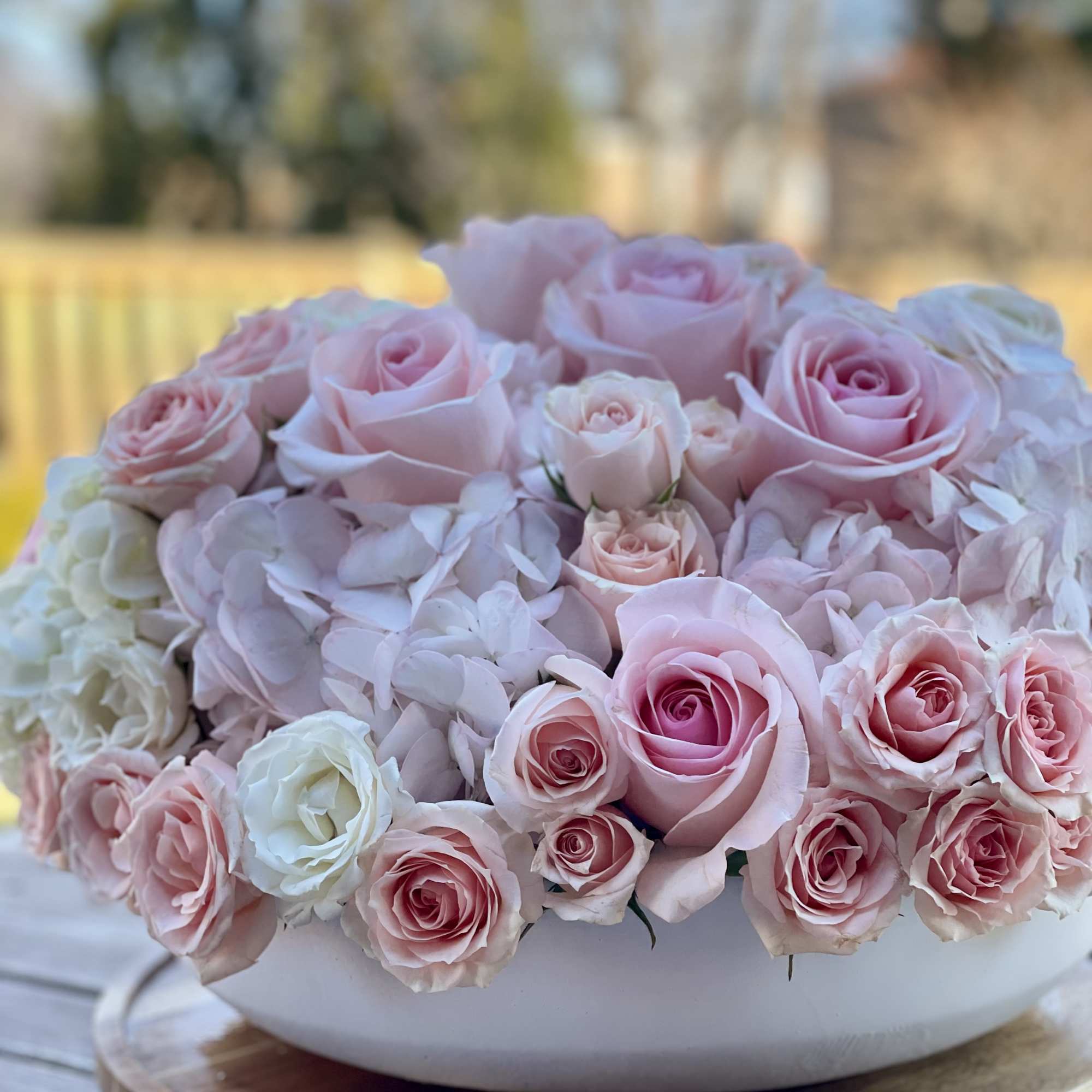 Larger than life arrangement featuring a blend of lush pinks and ivory