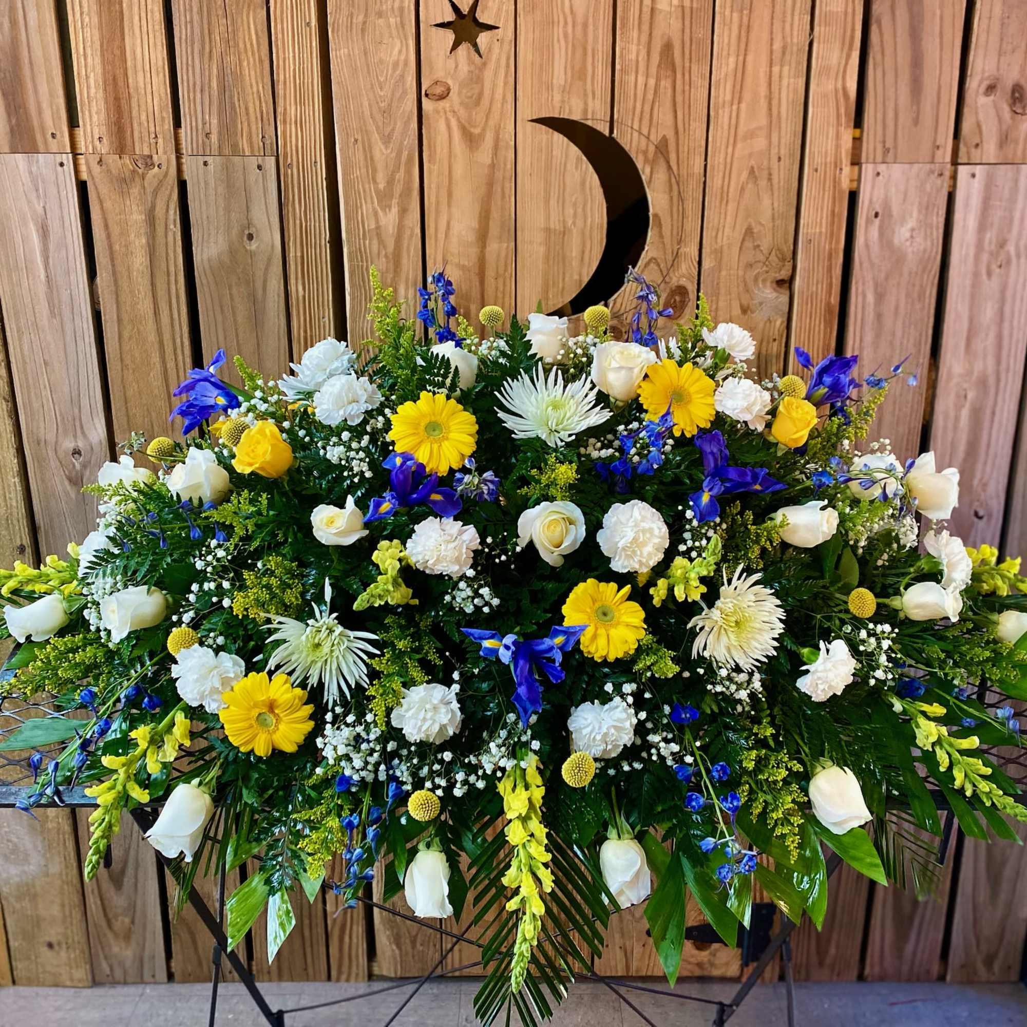 Blue and White flowers with a pop of yellow gerberas.