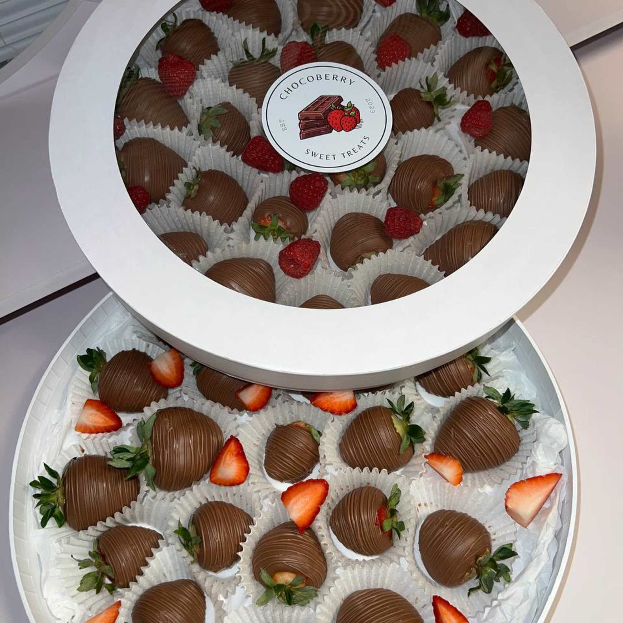 Experience pure indulgence with our Signature Round Chocolate-Dipped Strawberries. Each perfectly ripened