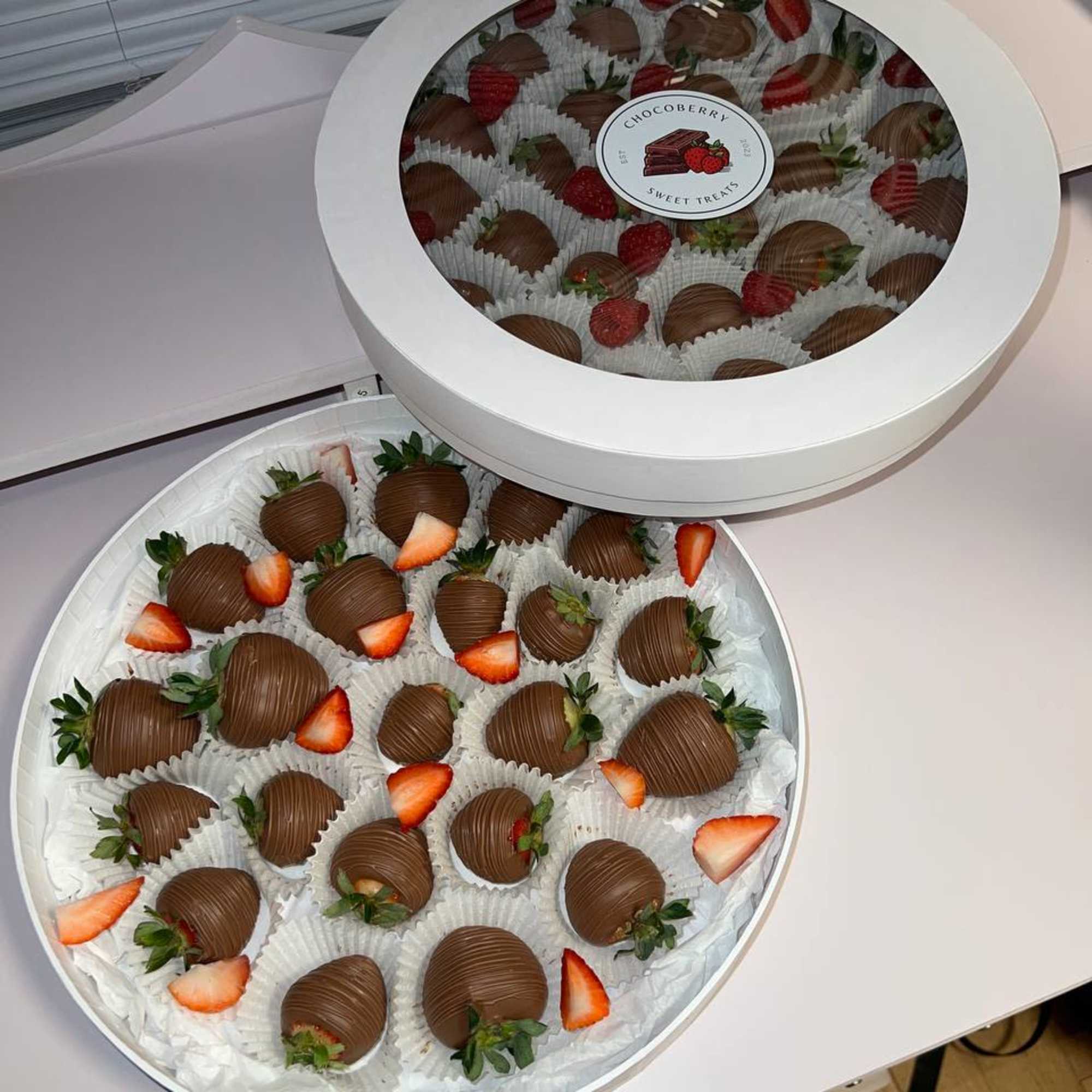 Experience pure indulgence with our Signature Round Chocolate-Dipped Strawberries. Each perfectly ripened