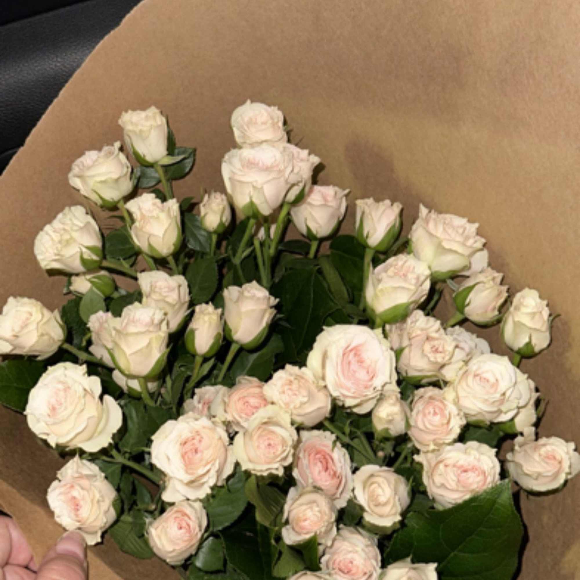 Our Blushing Spray Rose Bouquet is a delicate and enchanting arrangement that