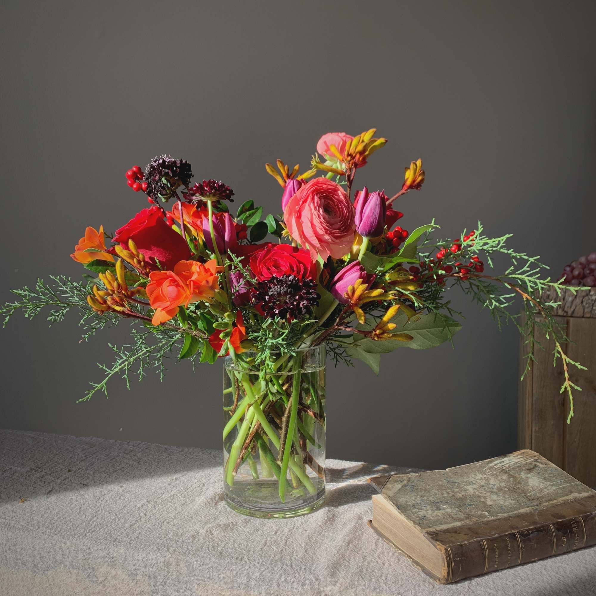 Receive fresh flowers arranged in a glass vase each week for three