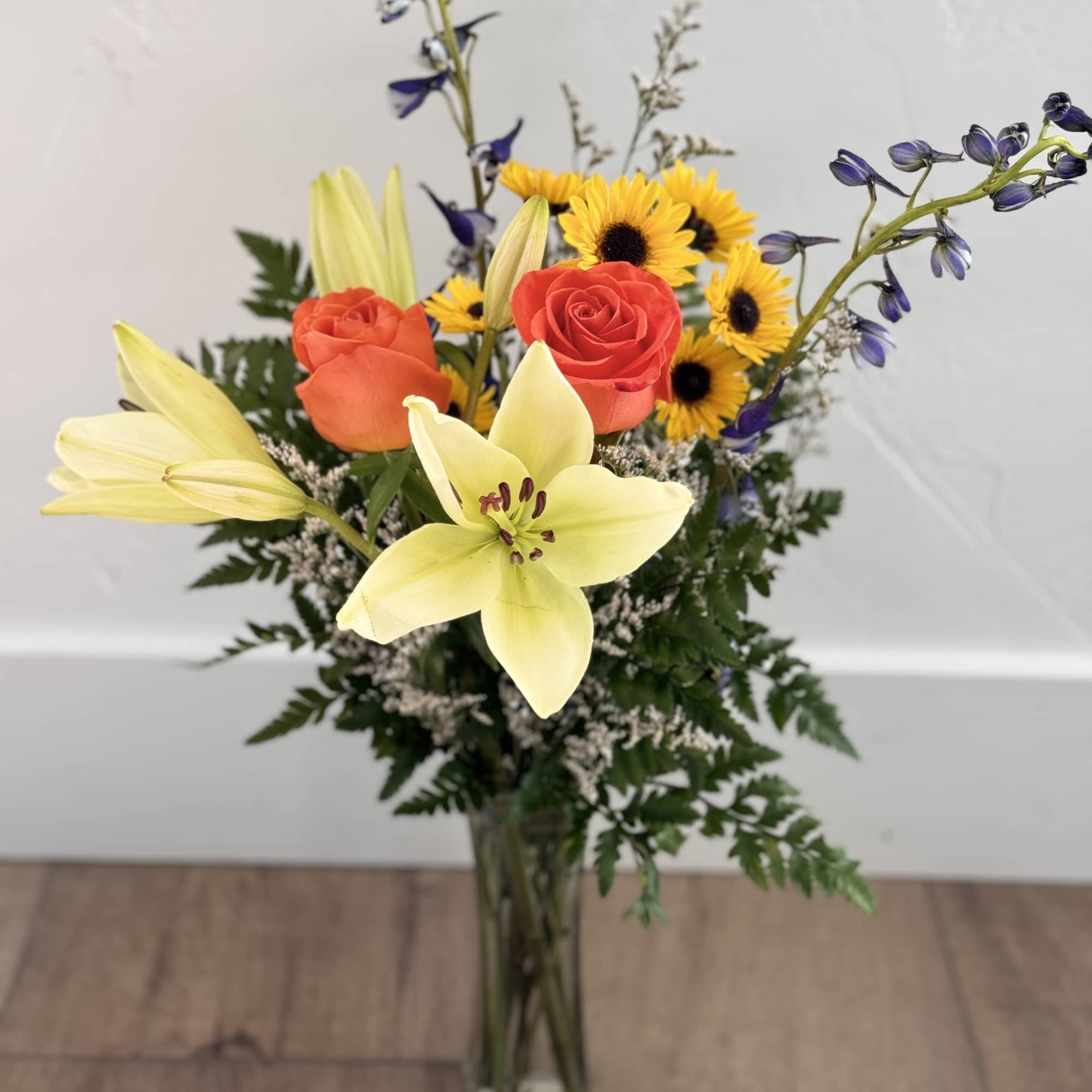 Tulips, Roses, and more! This Custom arrangement will include 4 flower stems