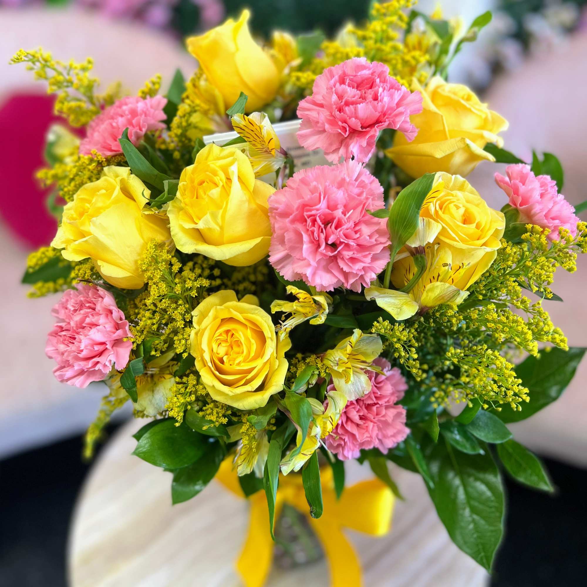 A cheerful blend of sunny yellow and soft pink blooms, our Lemon