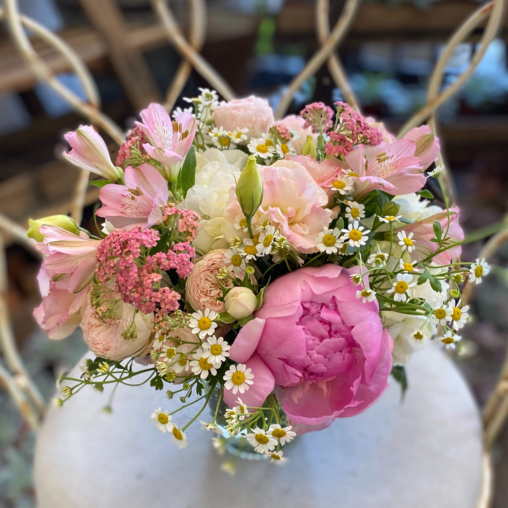 A beautiful arrangement of amazing seasonal pink blossoms in a ti leaf A beautiful arrangement of amazing seasonal pink blossoms in a ti leaf