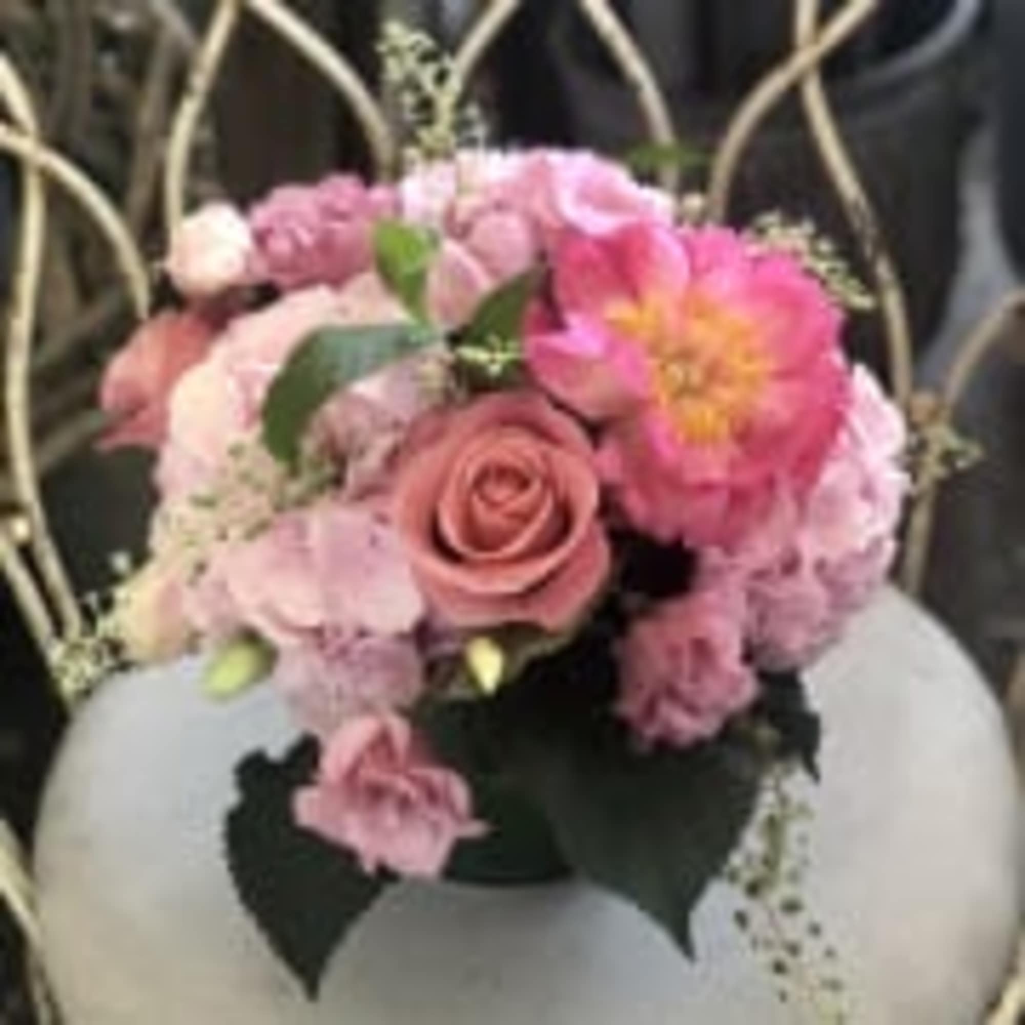 A beautiful arrangement of amazing seasonal pink blossoms in a ti leaf A beautiful arrangement of amazing seasonal pink blossoms in a ti leaf