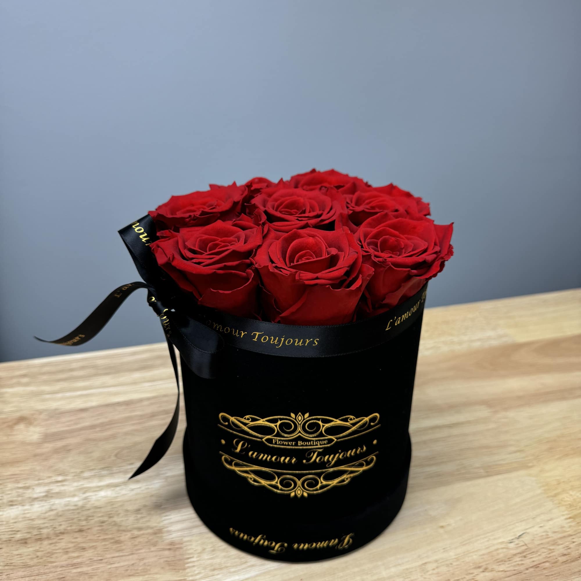 Mini black velvet box with 8 Everlasting roses. Everlasting roses are real