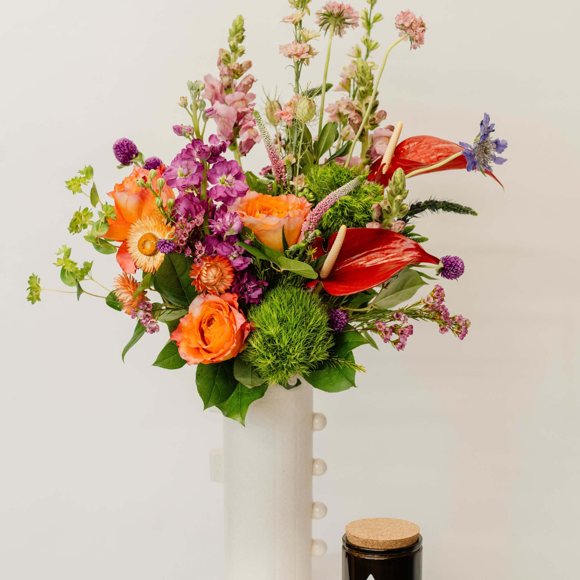 Our deluxe curated vase design bundle features an opulent fresh floral arrangement