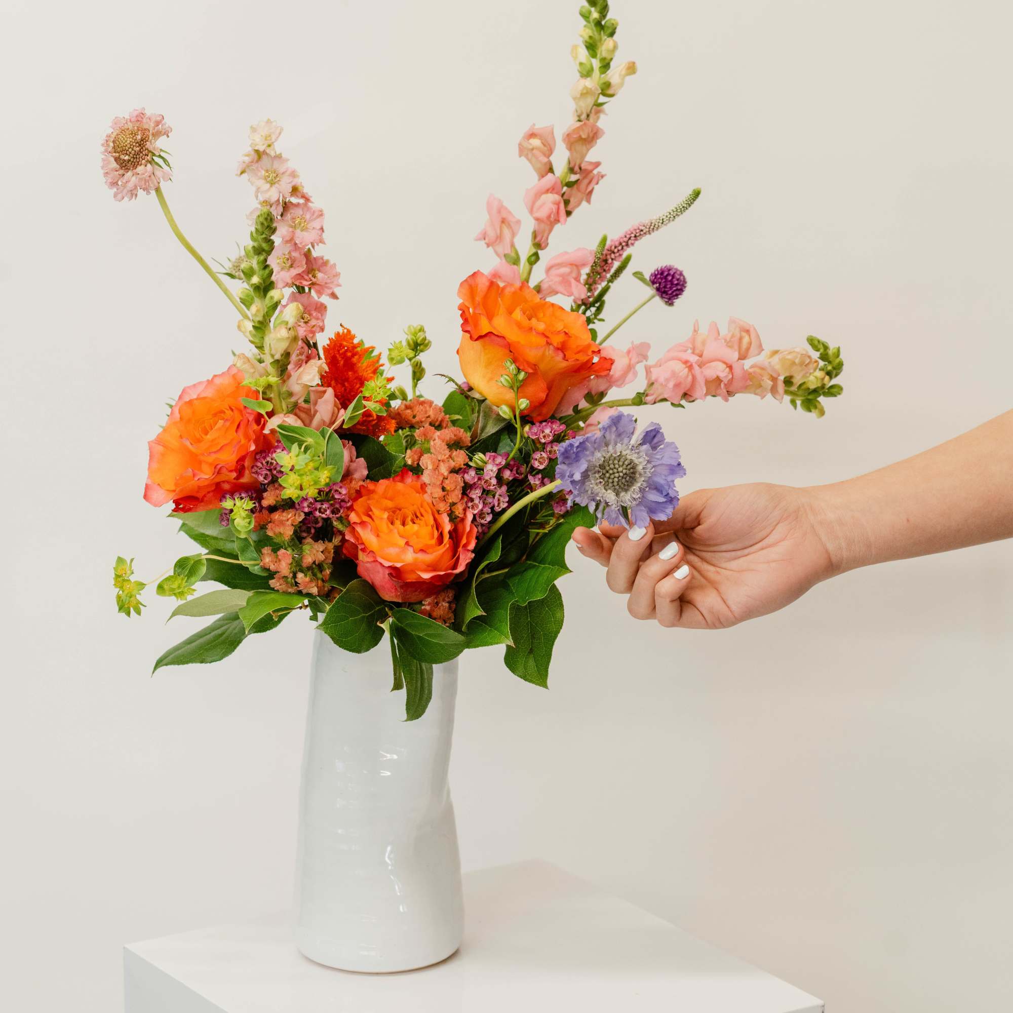 Our in-house designers will pick the best-looking florals and color schemes and